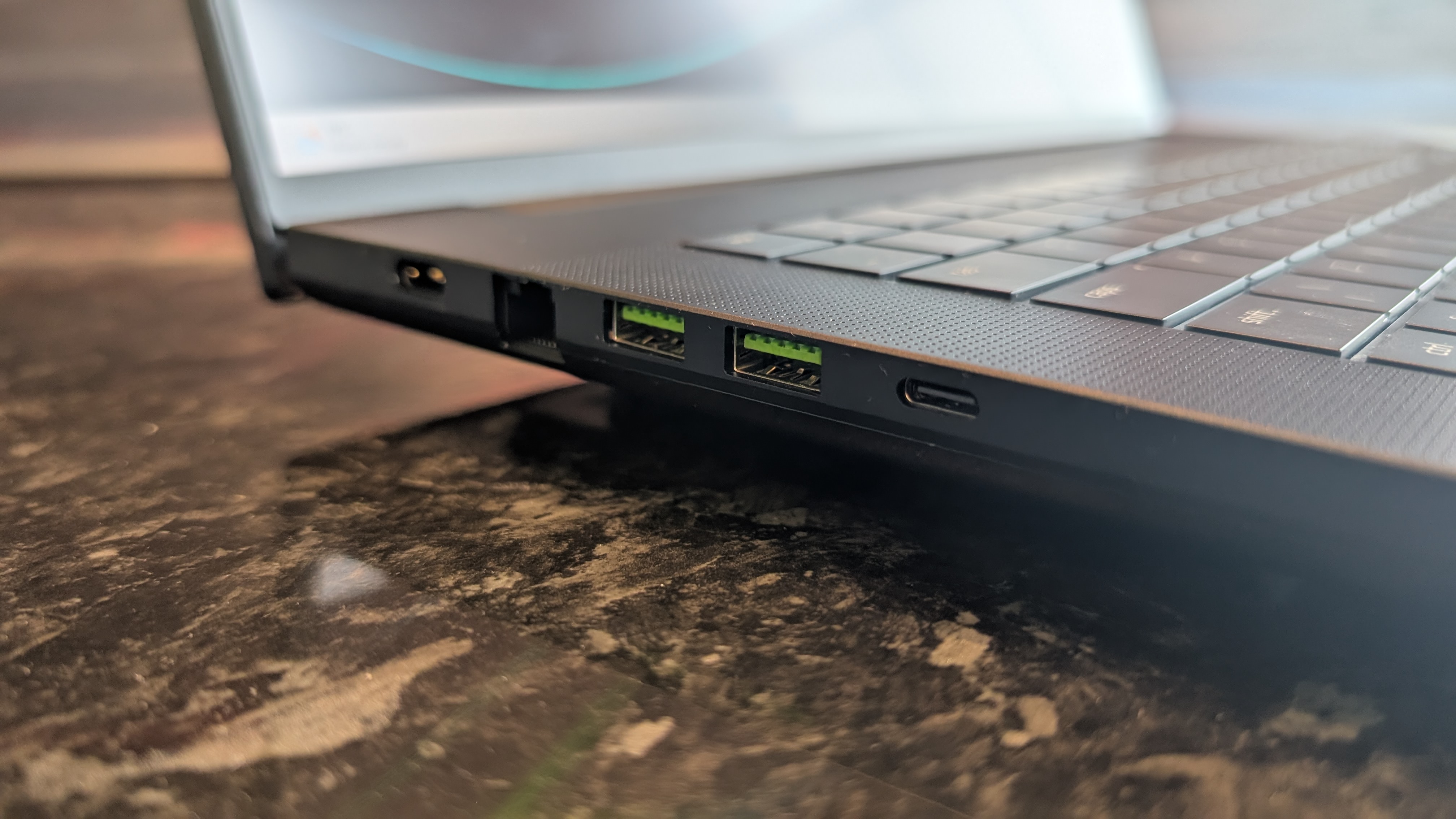 The Razer Blade 18 (2026) pictured on a black marble worktop.