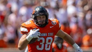 Oklahoma State Cowboys fullback Jake Schultz (38) runs the ball ahead of the Oklahoma State Cowboys vs Utah Utes live stream