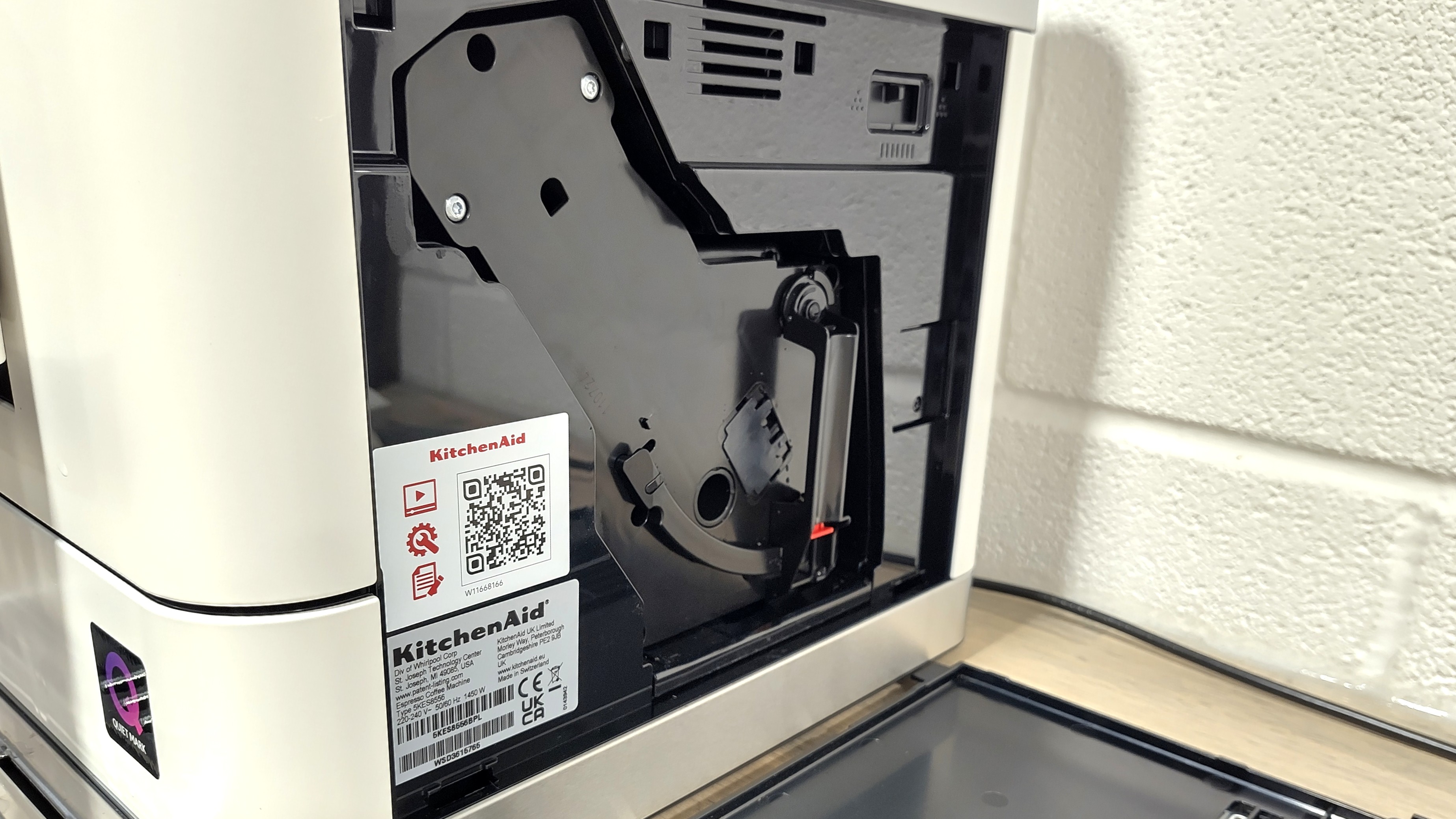 Service door opened on KitchenAid Fully Automatic Espresso Machine KF6 to show brewing unit