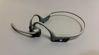 Shokz OpenComm UC on a gray surface