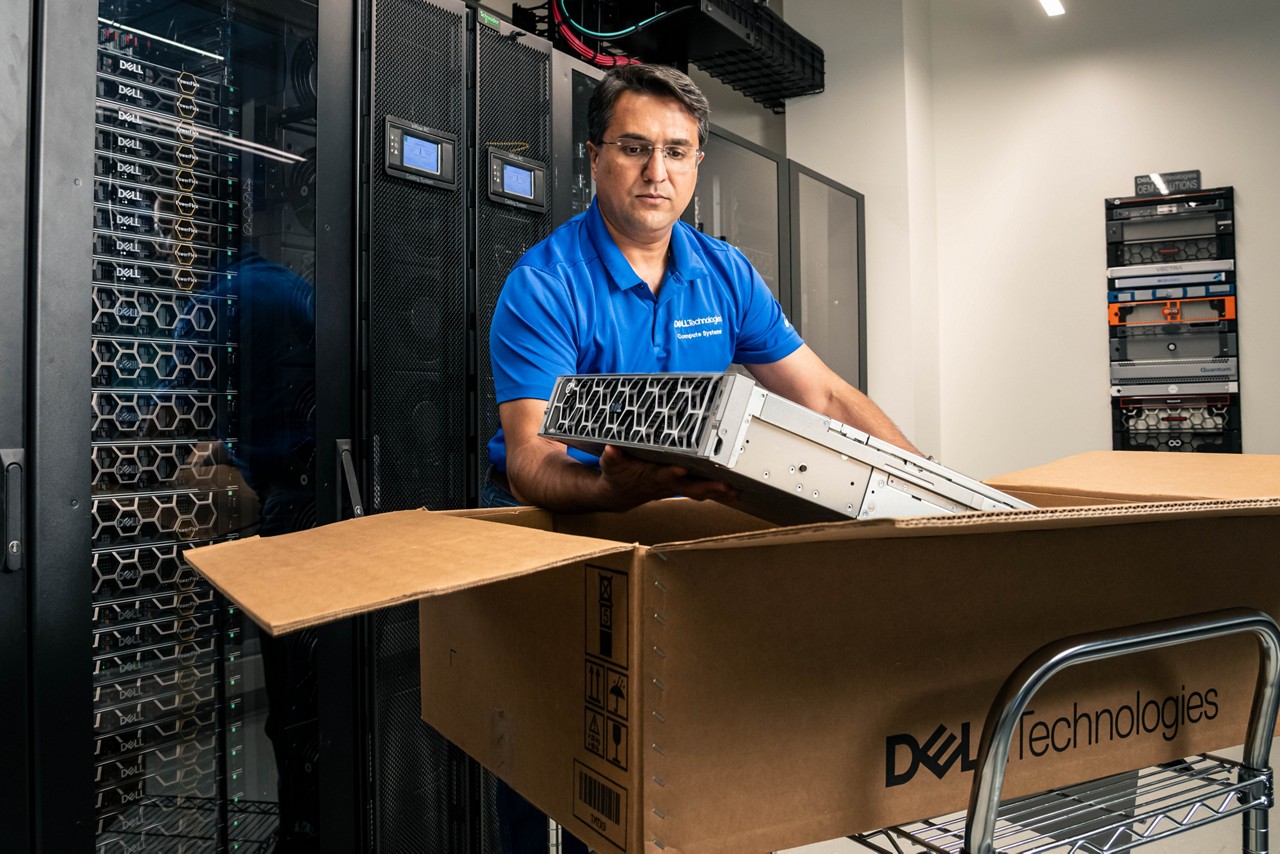 Engineer unpacking Dell server