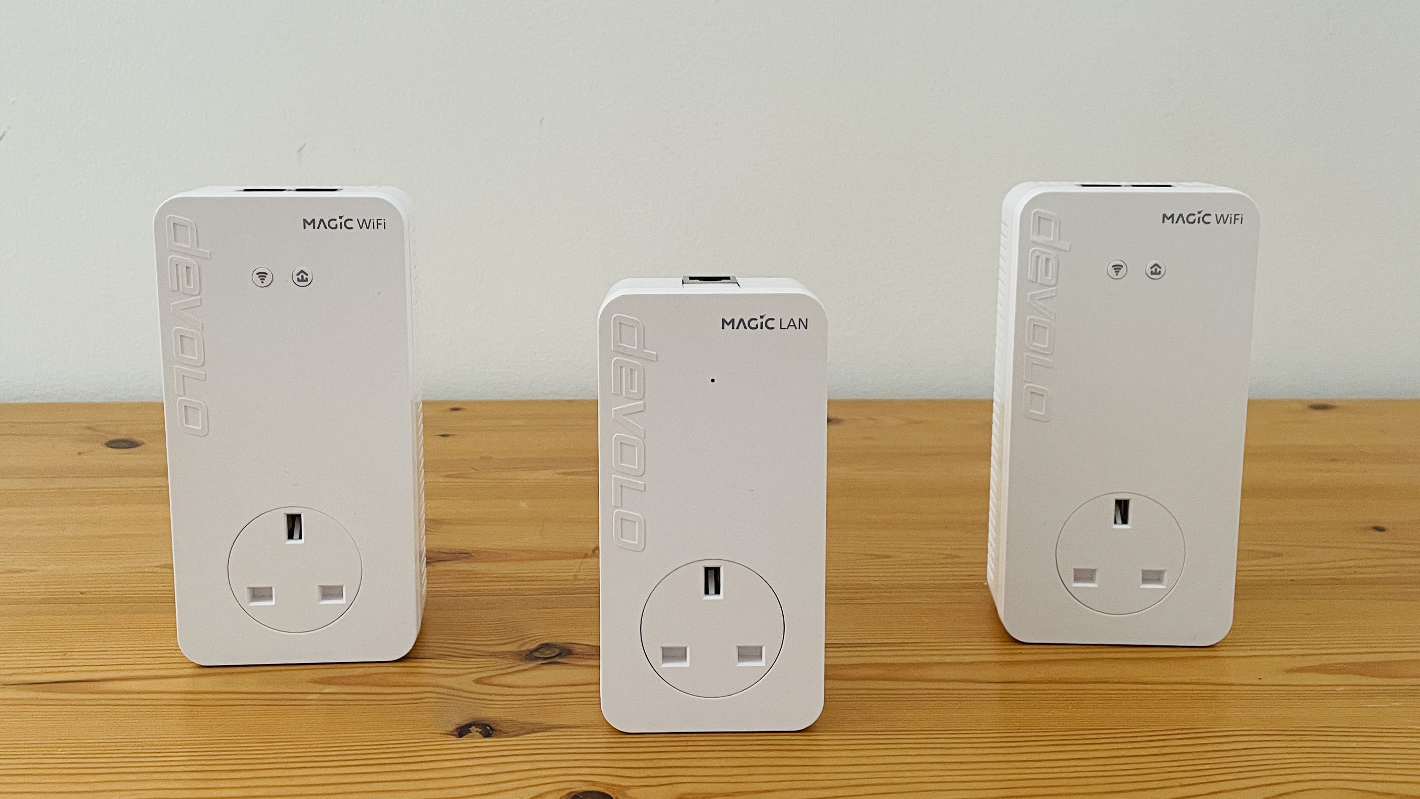 Devolo Magic 2 WiFi 6 next on wooden table