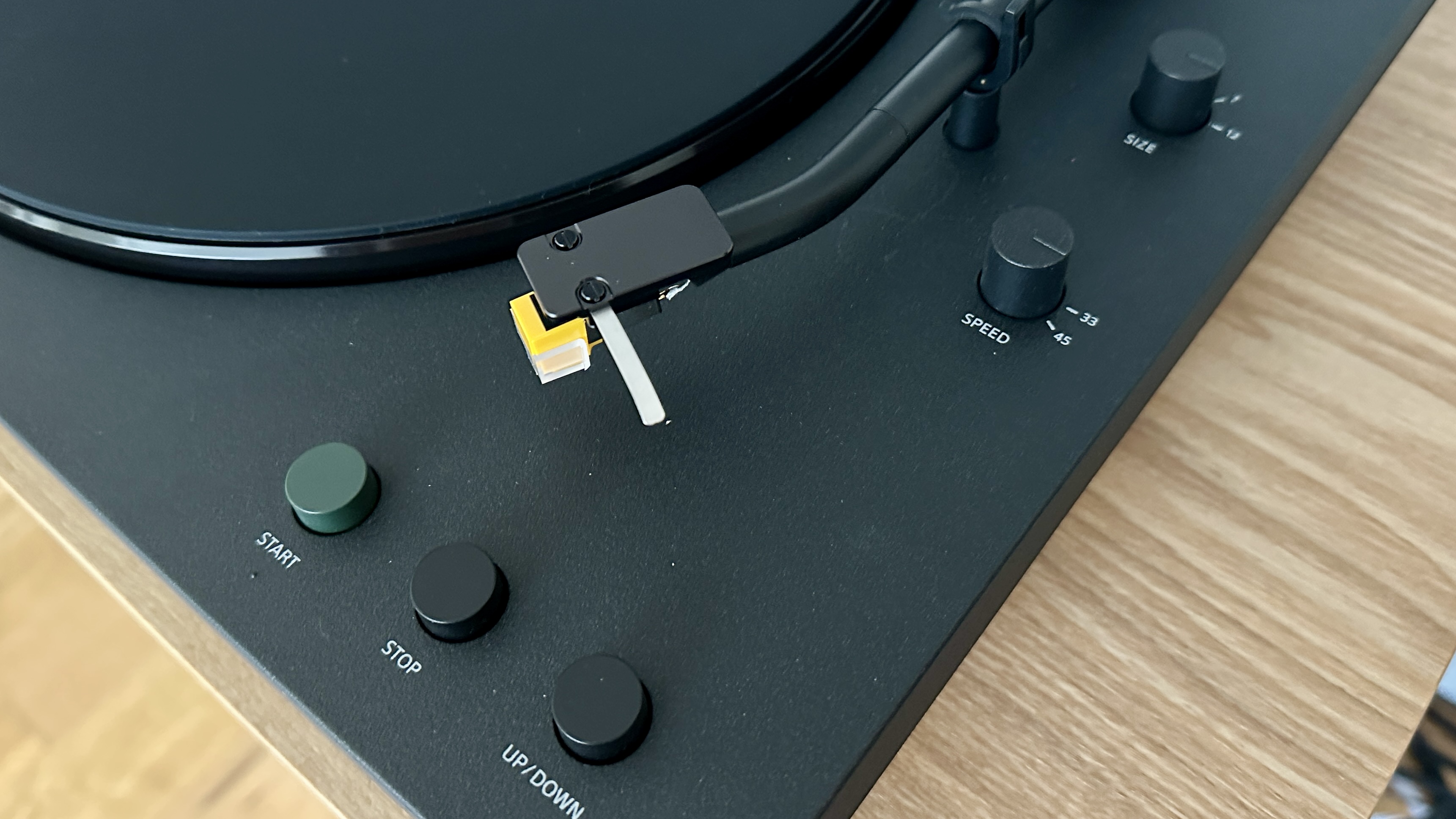 Sony PS-LX510BT turntable on a brown wood hi-fi rack, with closeups