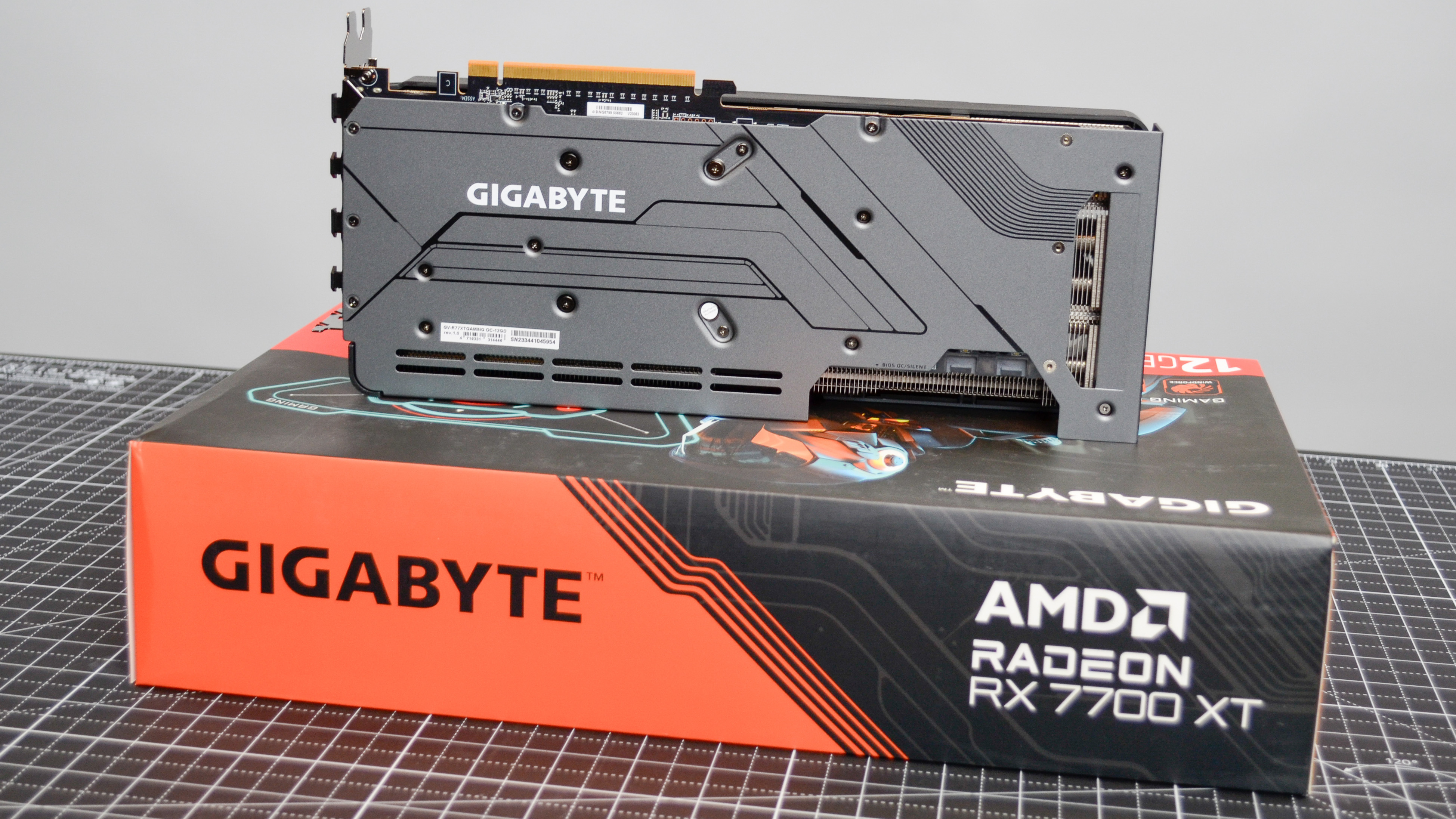 A Gigabyte Radeon RX 7700 XT Gaming OC on a desk