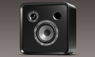 Eversolo speaker close up, with grille removed, on purple background