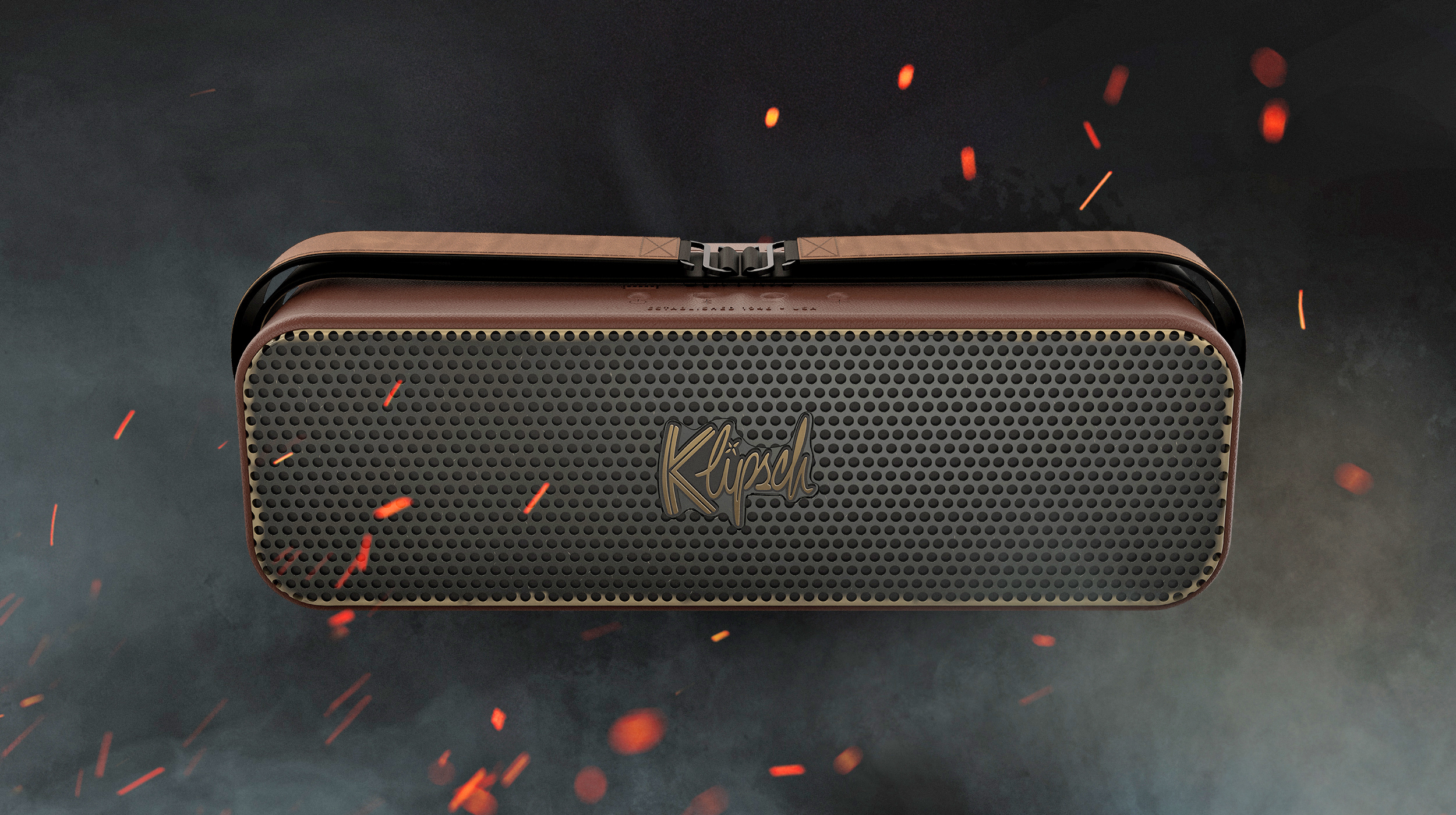 Klipsch The Odyssey speaker, with leather-like detailing, surrounded by smoke and sparks