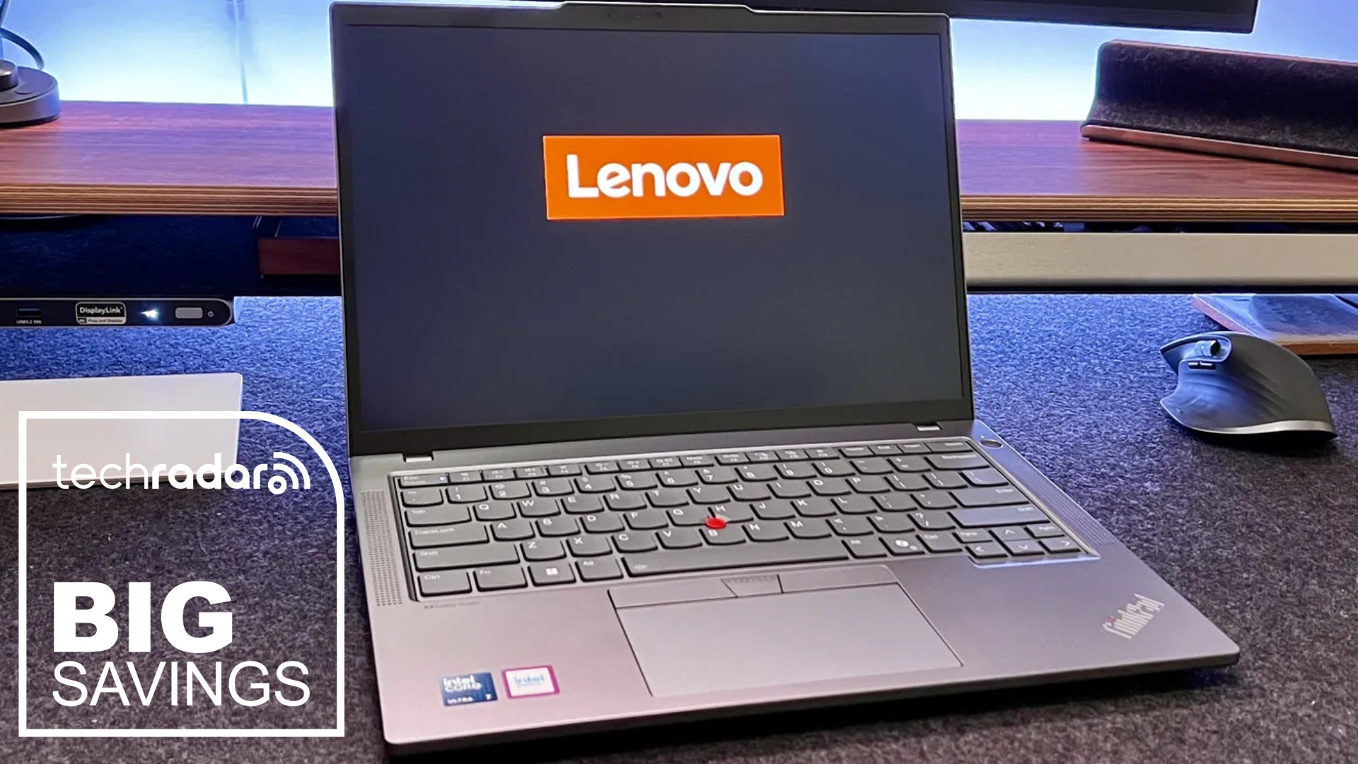 The Lenovo ThinkPad T14 on a home office desk during our review, with a white TechRadar badge in the lower left corner that reads 'Big Savings'
