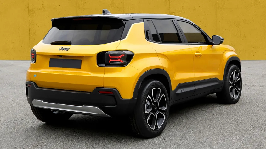 A yellow Jeep EV viewed at an angle, from the back