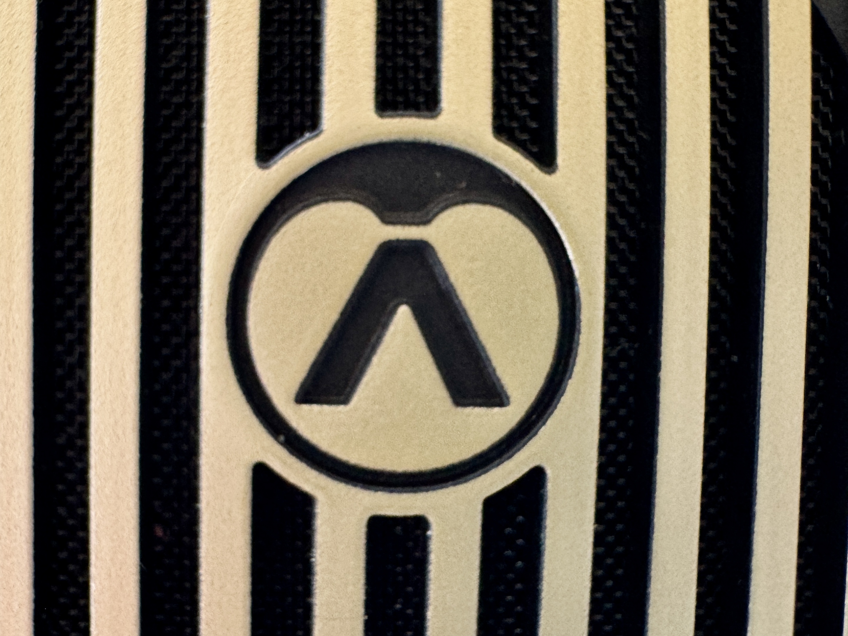 Close-up of the outer ear cup of the Austrian Audio The Arranger over-ear headphones.
