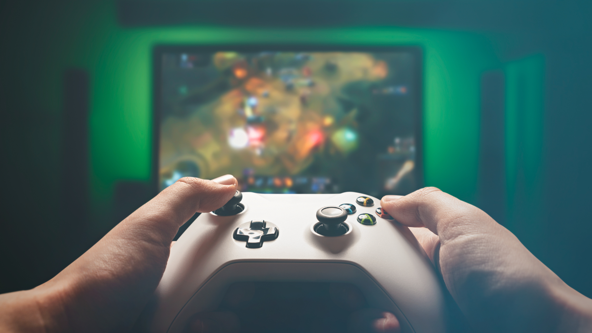 Man holding gamepad and playing RPG