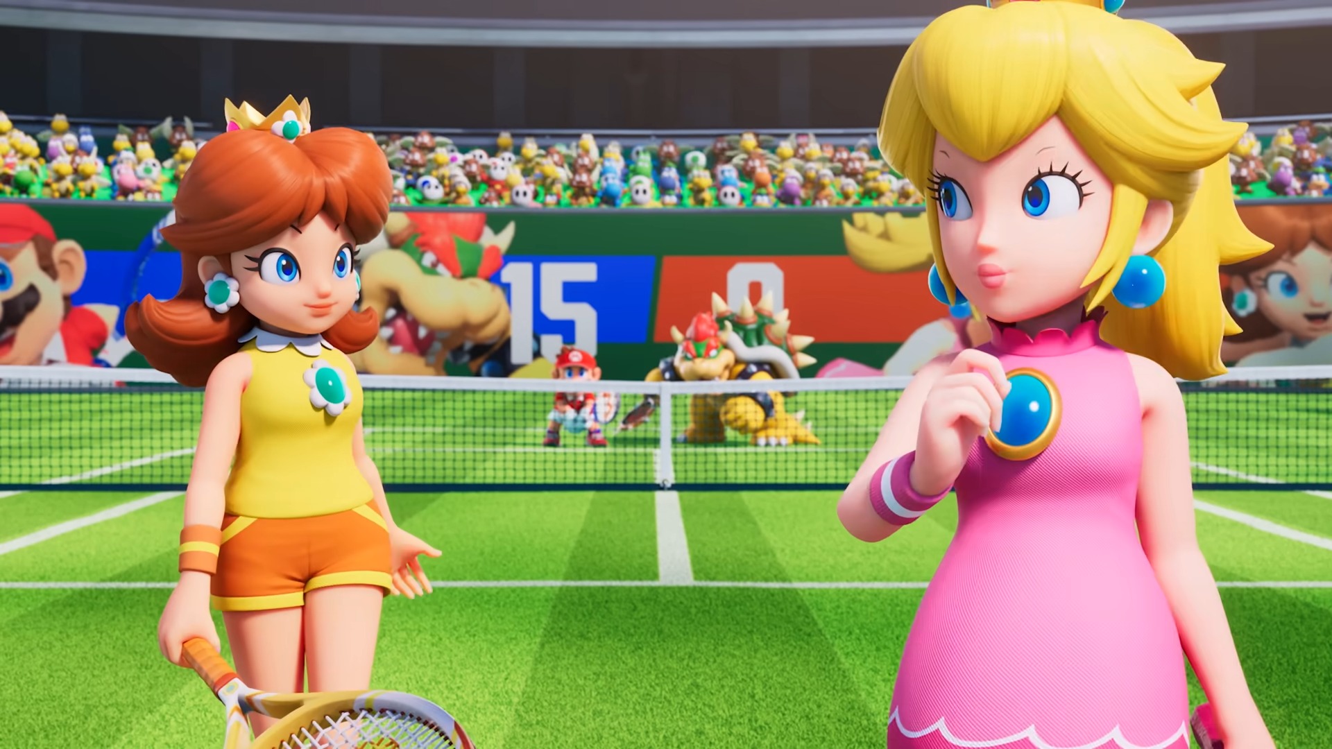 Peach and Daisy standing on a tennis court. Mario and Bowser can be seen in the background