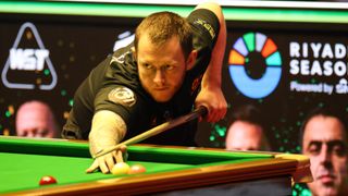 RIYADH, SAUDI ARABIA: Mark Allen of Northern Ireland plays a shot in the Quarterfinal match against Mark Selby of England on day two of Riyadh Season Snooker Championship at Boulevard City