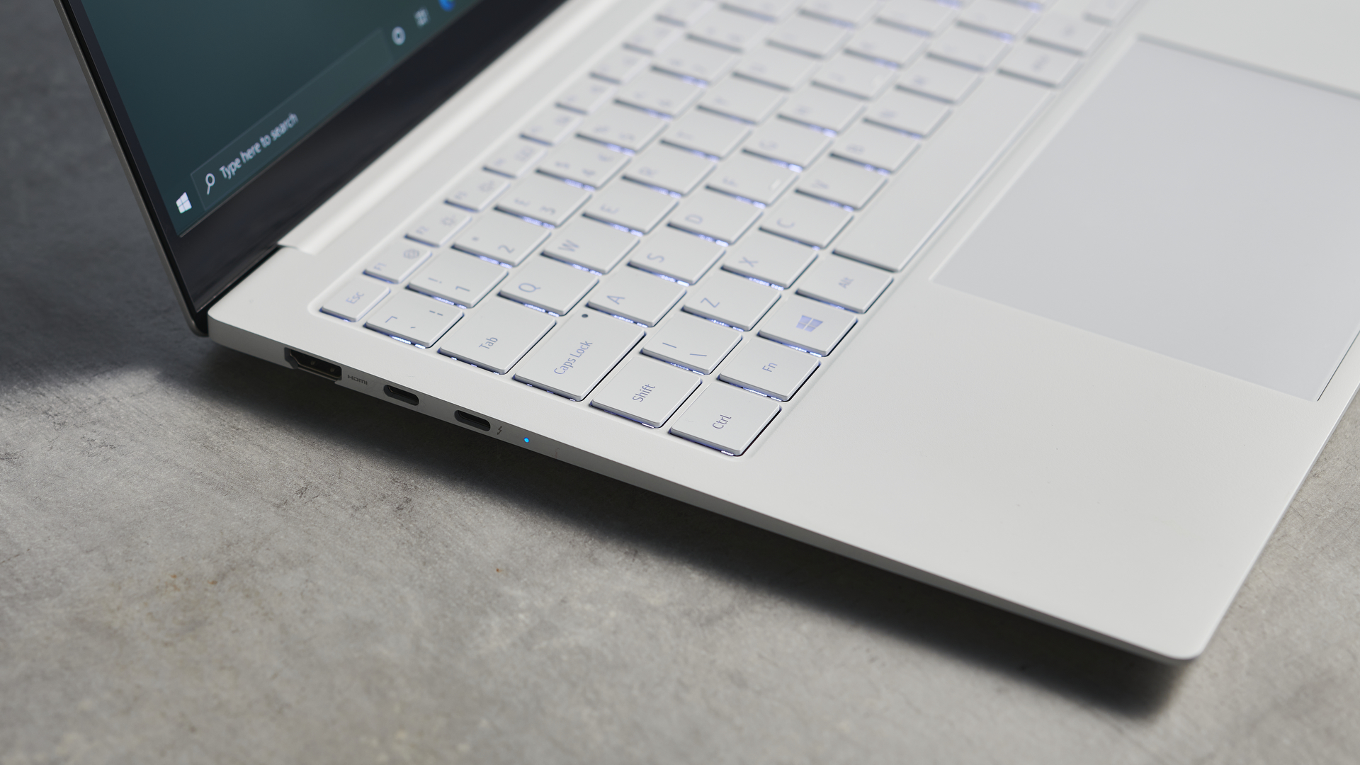 Samsung Galaxy Book Pro on wooden table, with a close up of the ports