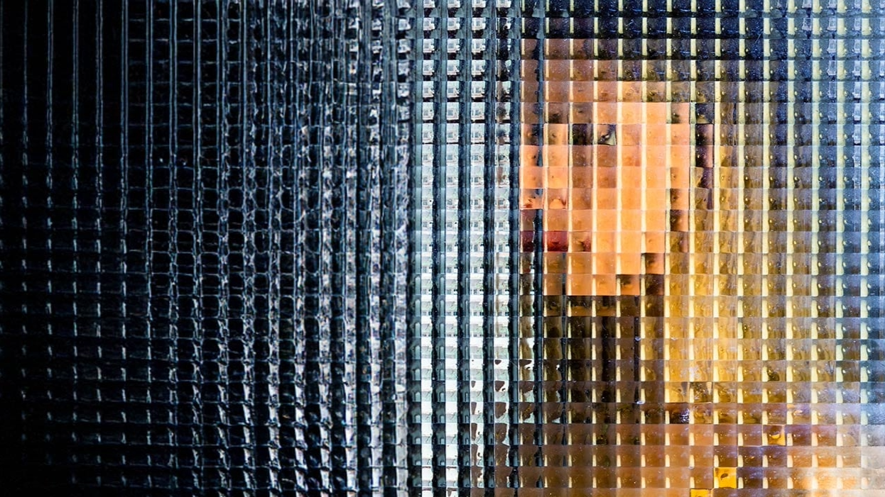 Woman on the other side of a window, obscuring her image.