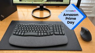 The Logitech Wave Keys and Logitech Lift on a wooden desk