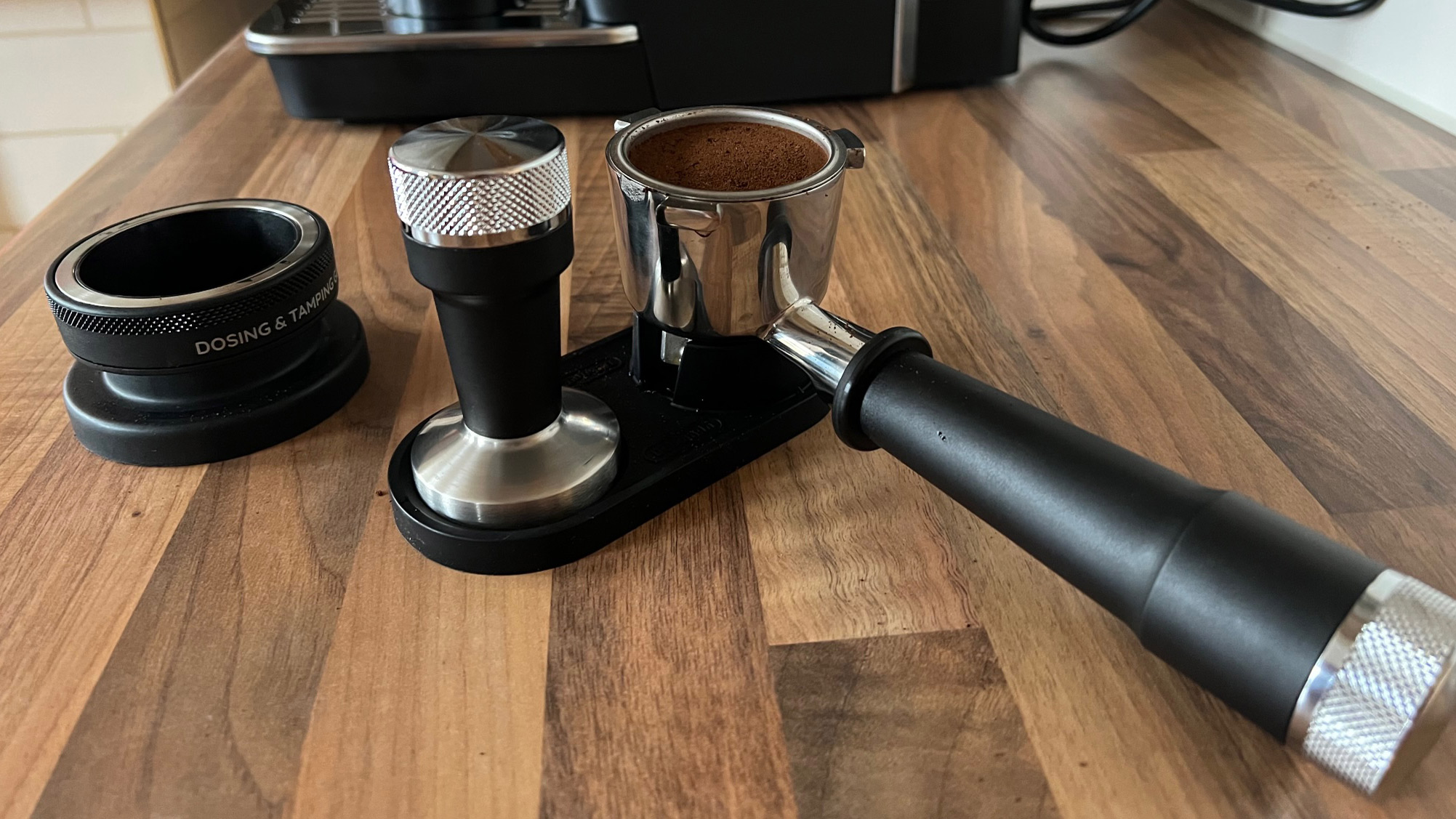 The tamp, tamping stand and dosing funnel that comes with the De&amp;rsquo;Longhi La Specialista Arte EC9155MB