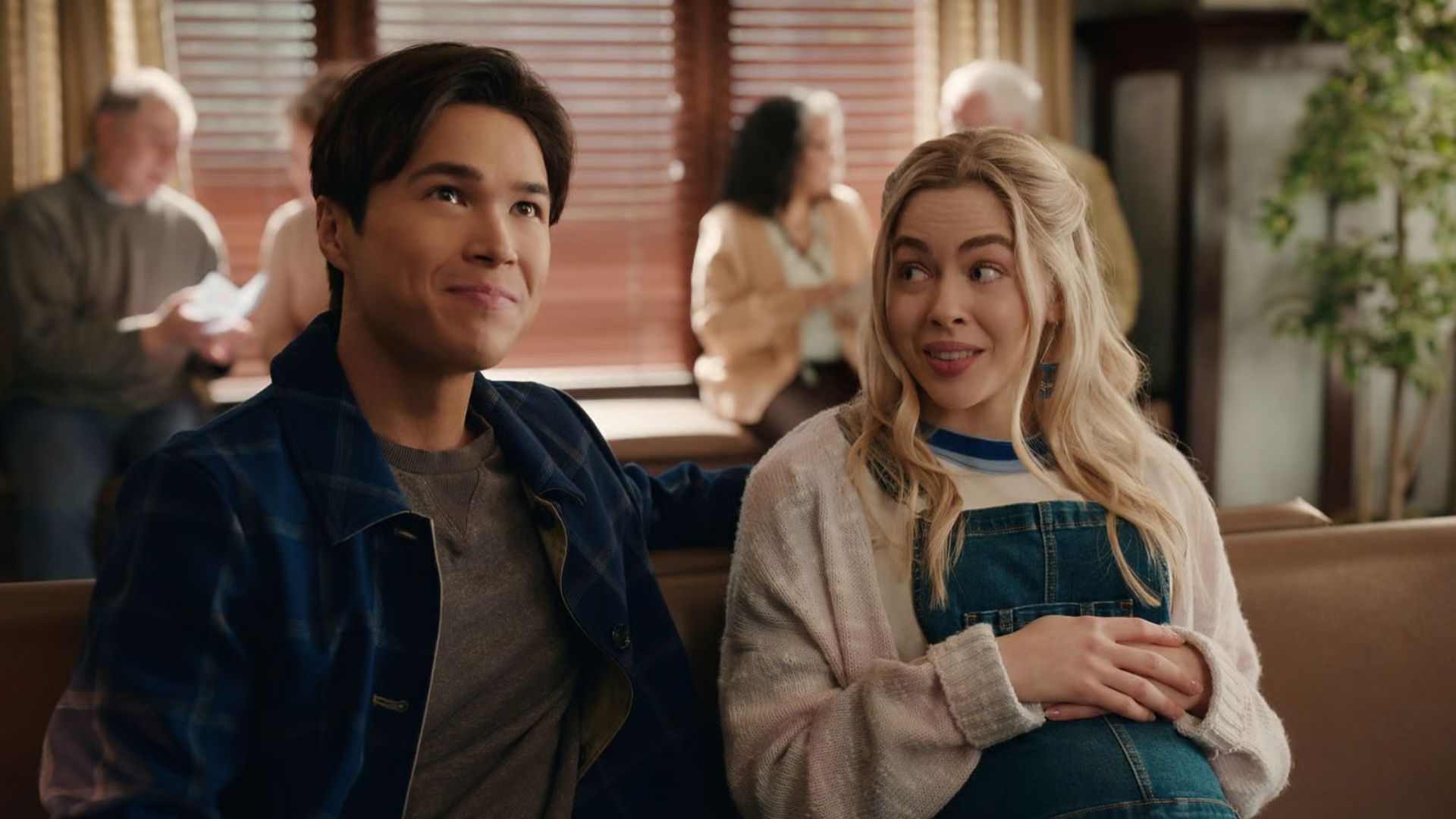 Lizzie and Denny sit in a waiting room