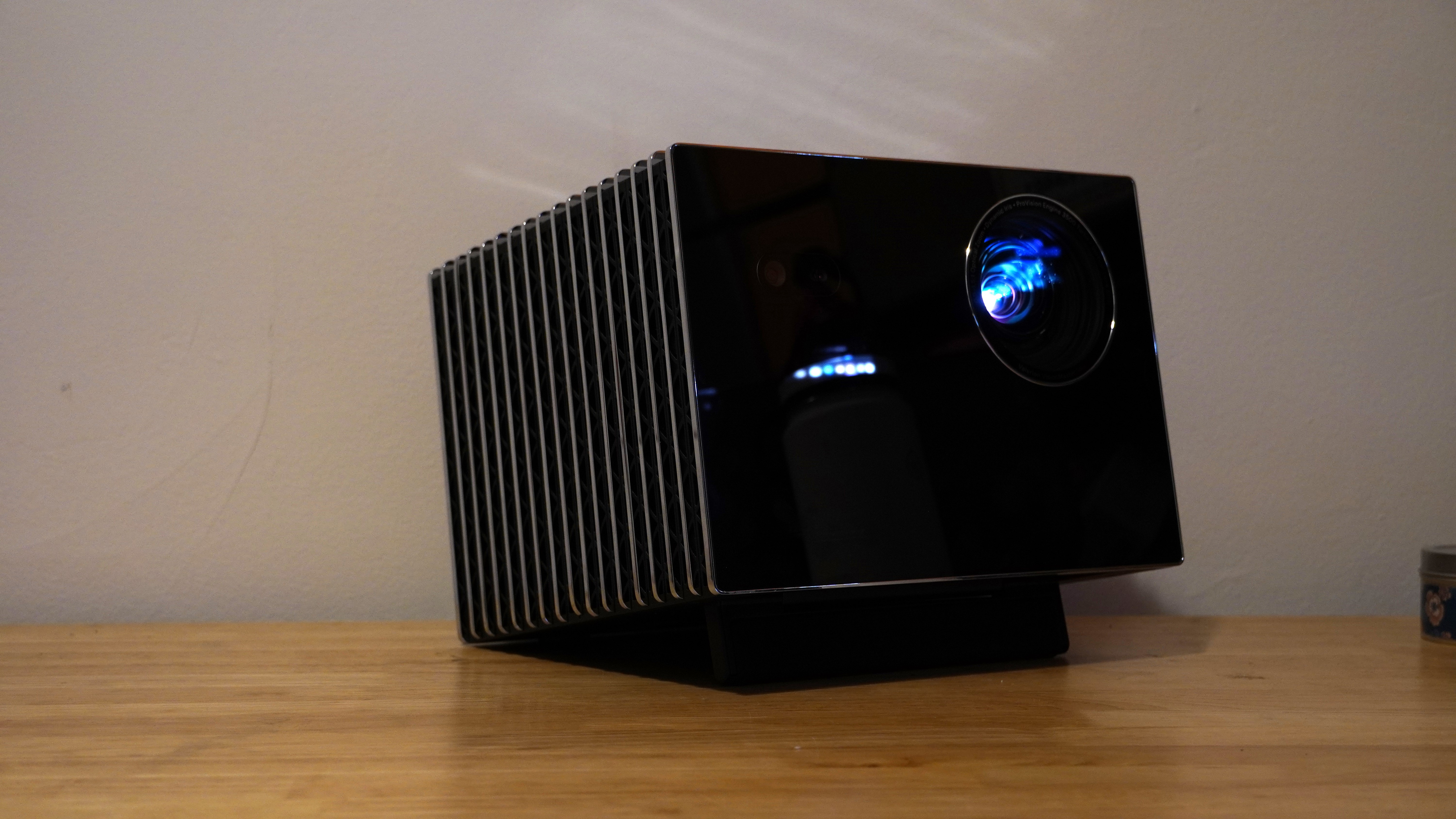 The Valerion VisionMaster Max projector on a wooden surface