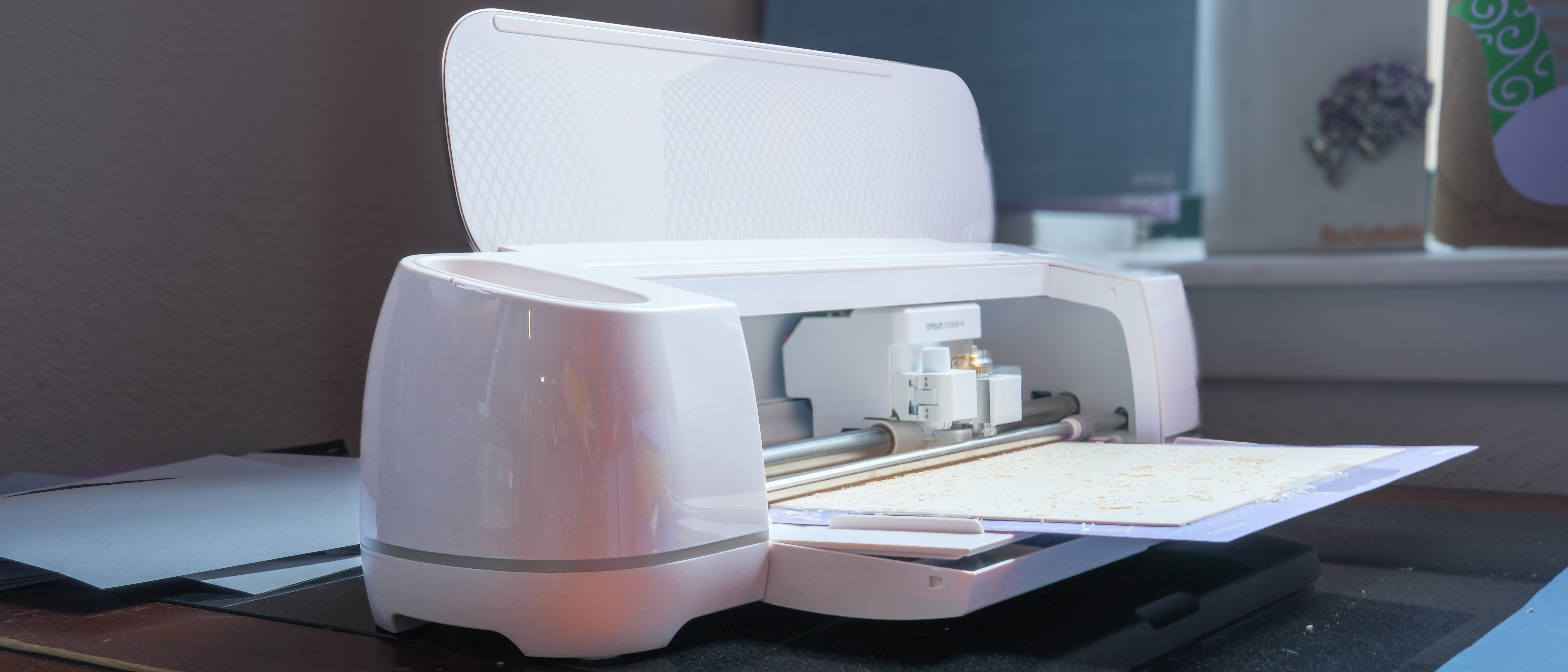 Cricut Maker 4 cutting machine making projects with basswood and cardstock