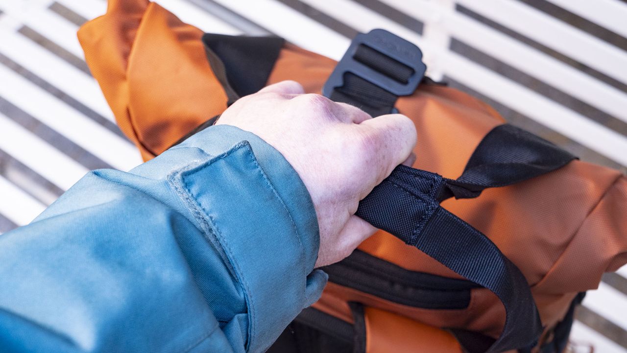 Wandrd PRVKE V4 bag on a white metal bench