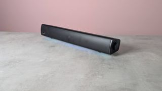Creative Sound Blaster GS5 on a desk with pink wall in background