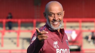 Nuno Espirito Santo, head coach of West Ham United, smiles and points.