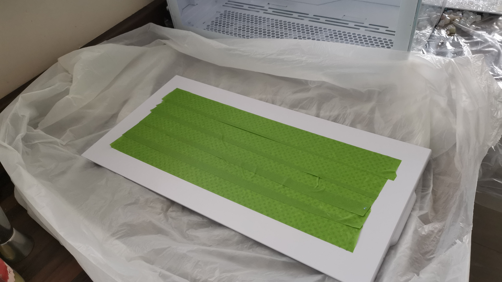 Side panel of the Lian Li 011D Mini taped up