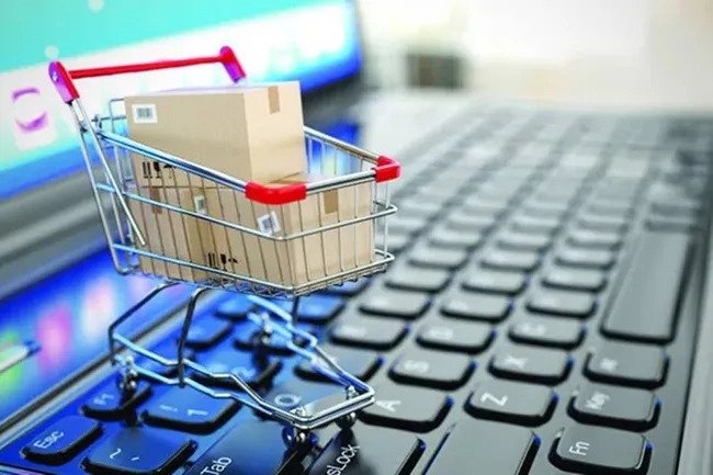 A small rolling cart on top of a laptop keyboard