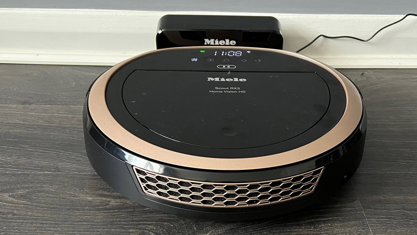 The Miele Scout RX3 Vision HD on its charging dock
