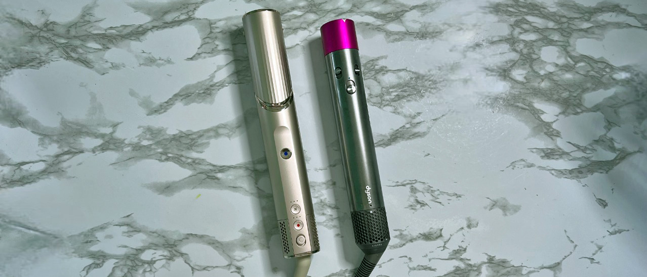 Dyson Airwrap next to Shark FlexiStyle on dressing table 