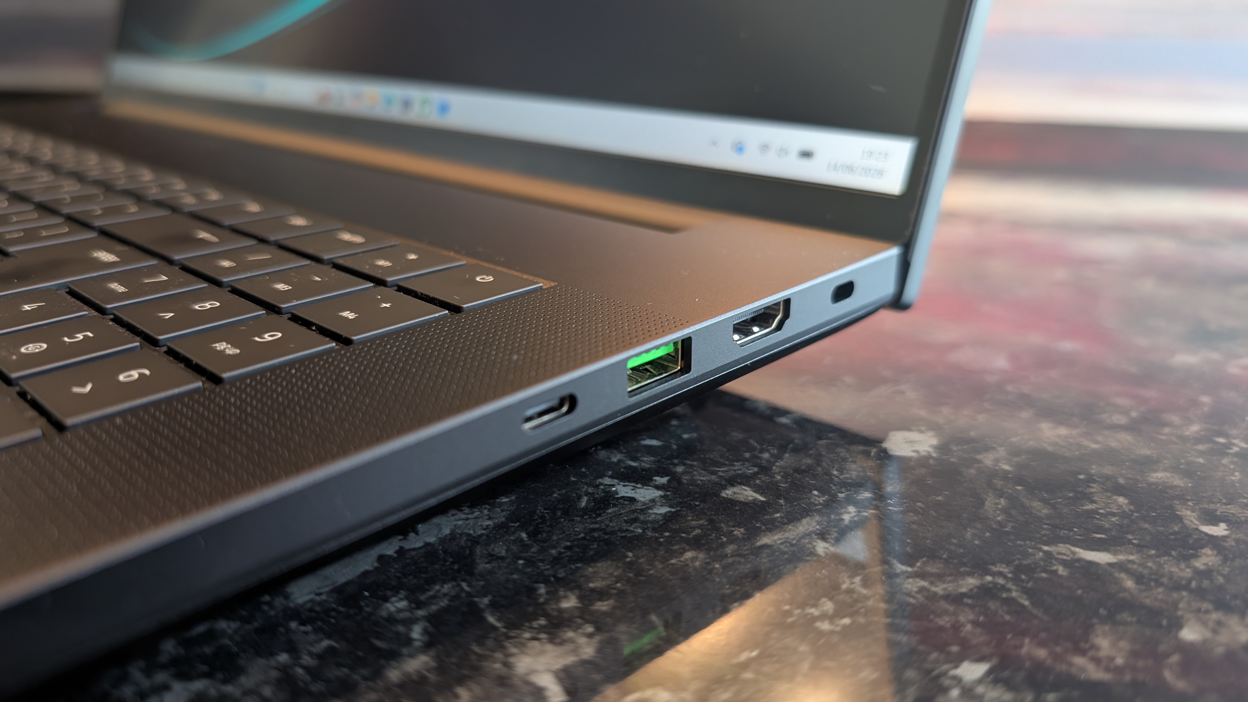 The Razer Blade 18 (2026) pictured on a black marble worktop.
