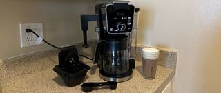 ninja dualbrew on counter top next to a coffee