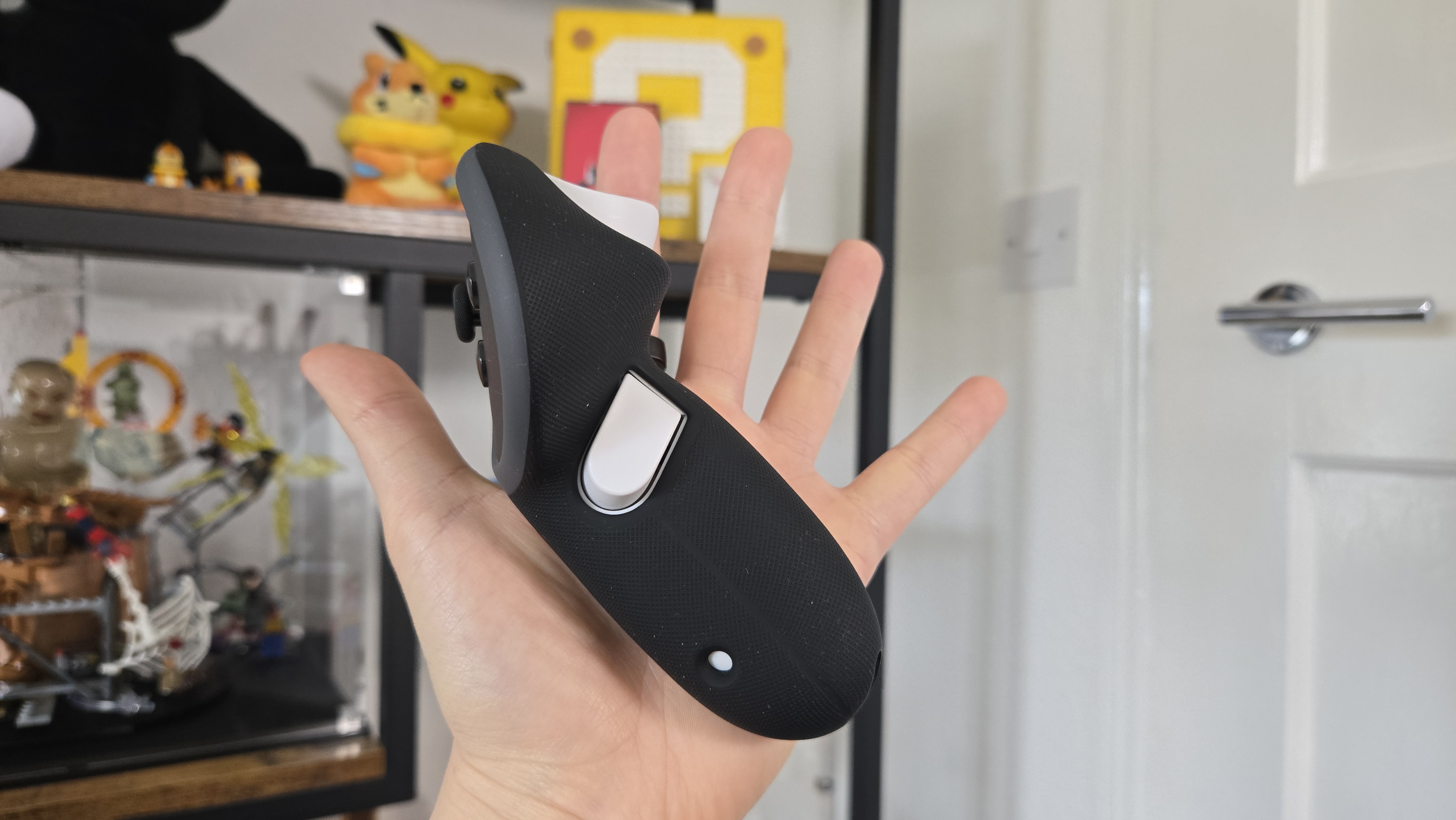 The Kiwi design G4 Pro Performance Controller Grips staying in a person's hand