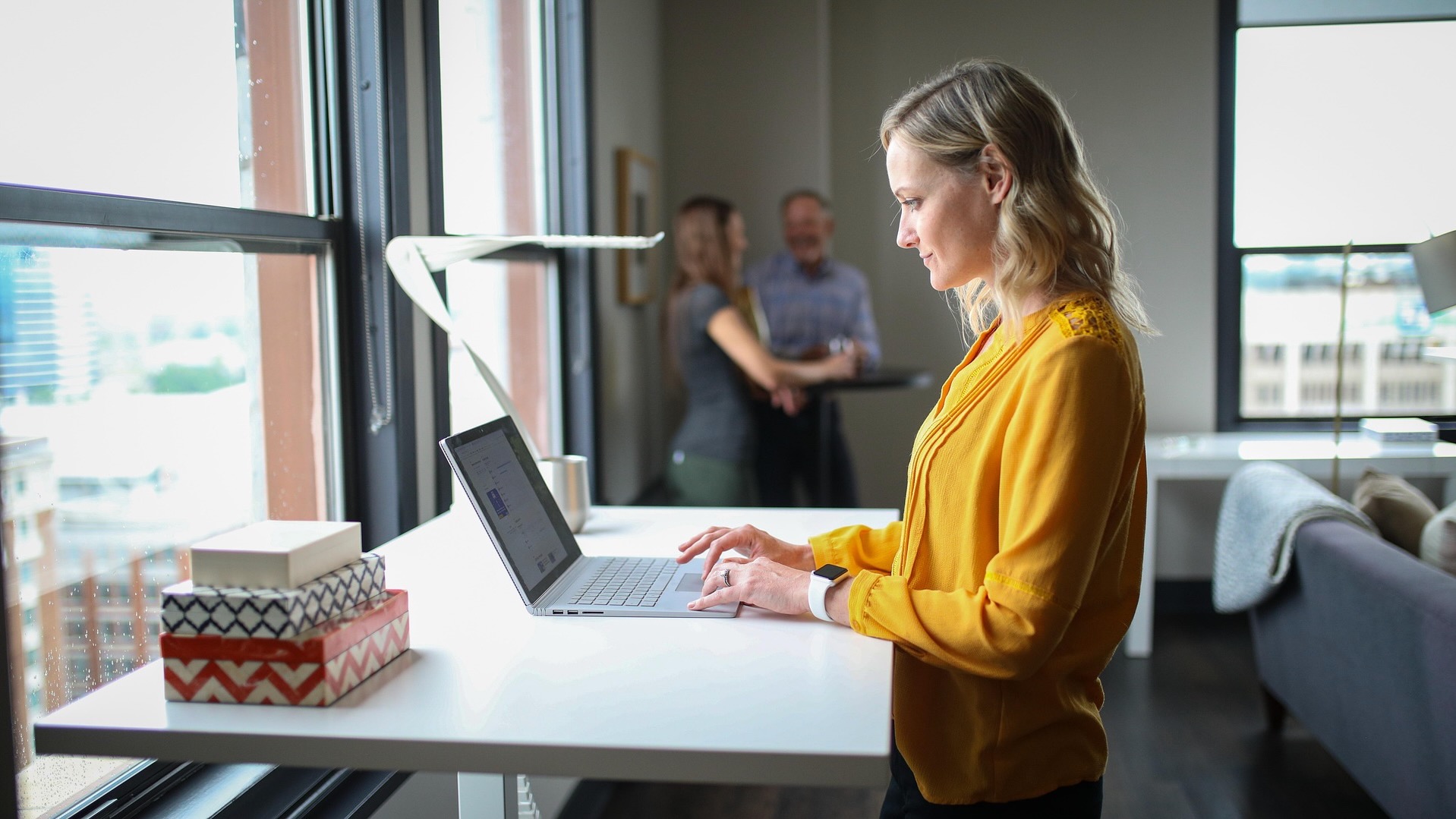 Person at standing desk. 
