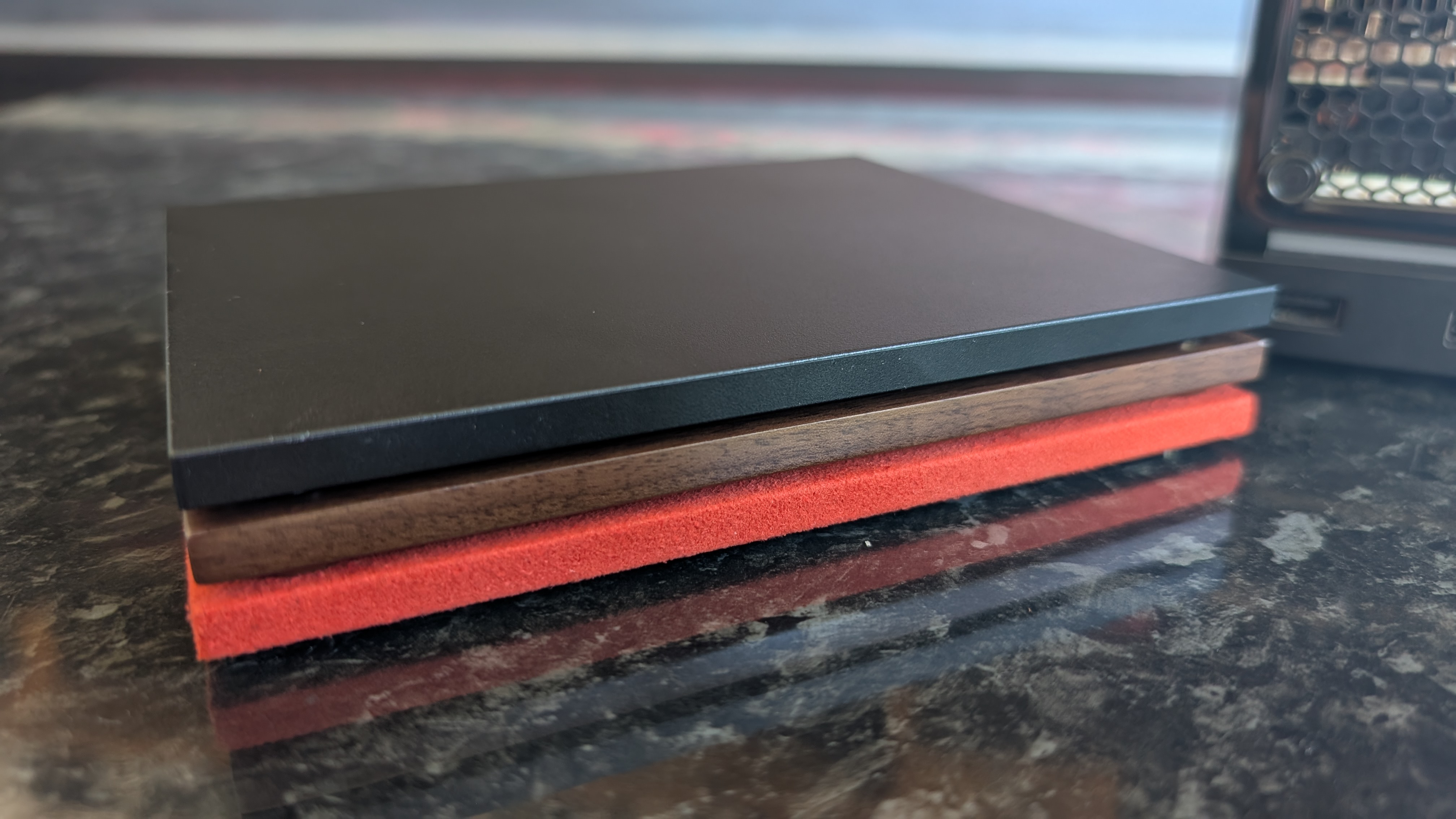 The Valve Steam Machine, pictured on a dark marble worktop.