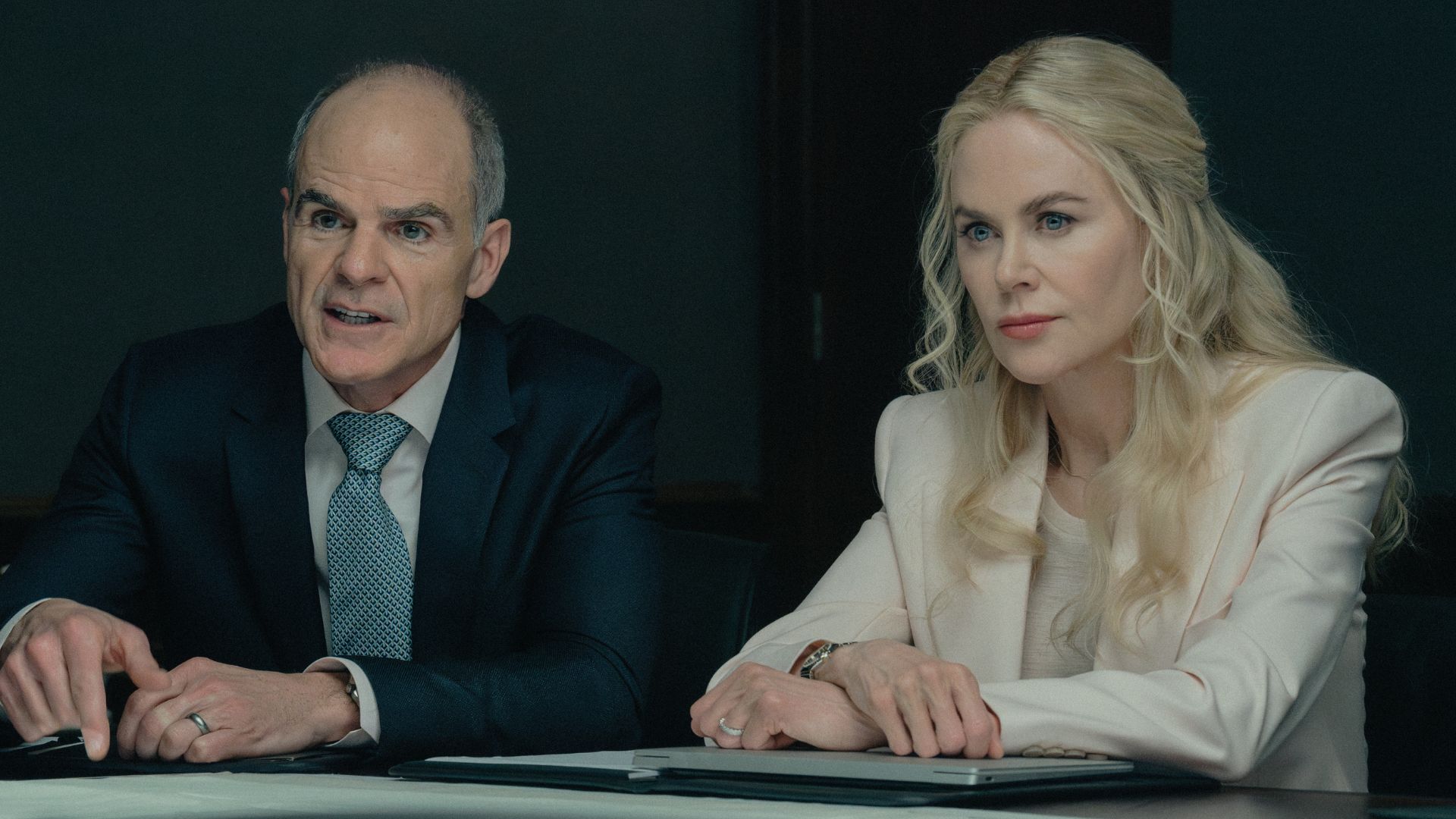 Byron and Kaitlyn look across a desk