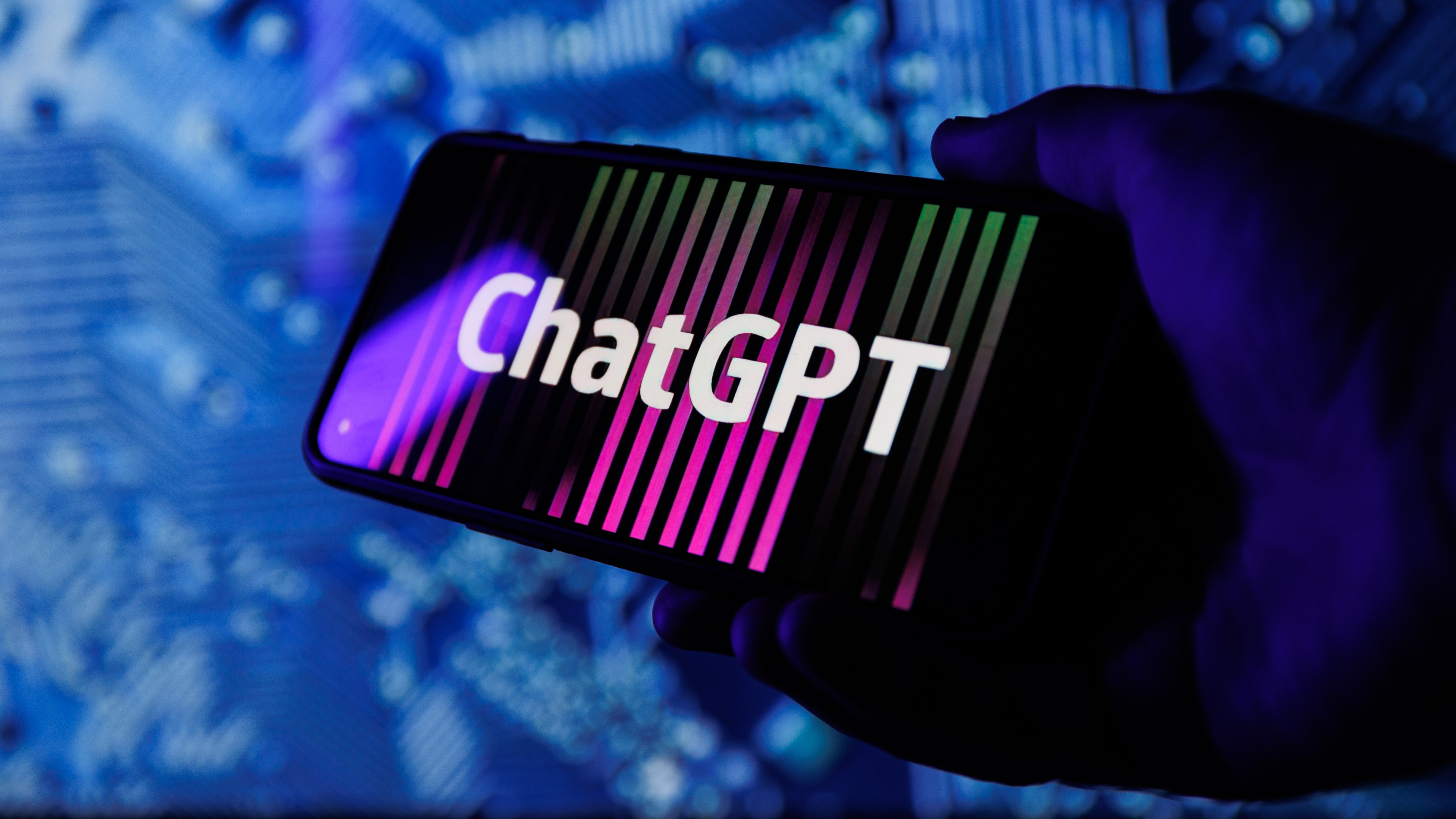 ChatGPT OpenAI logo on smartphone in conceptual Artificial intelligence futuristic background