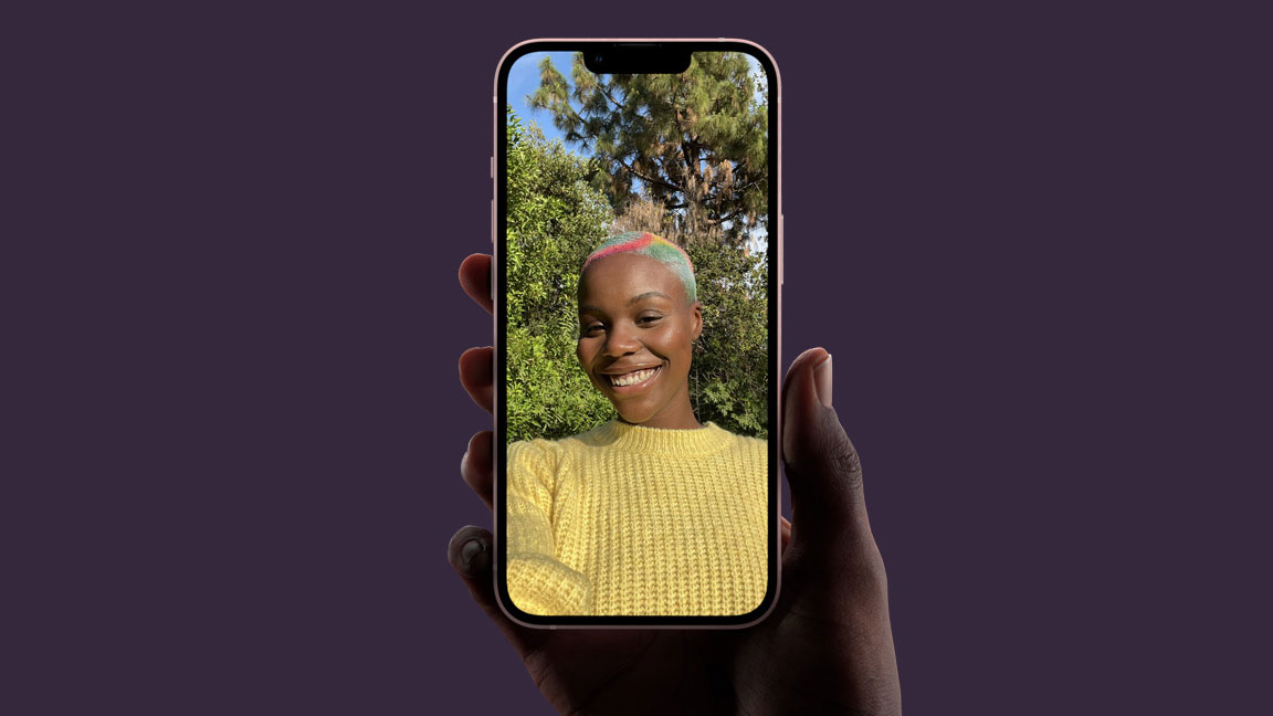 Phone being held in hand while user takes selfie