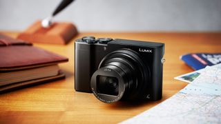 The Panasonic Lumix TZ100 camera sitting on a table