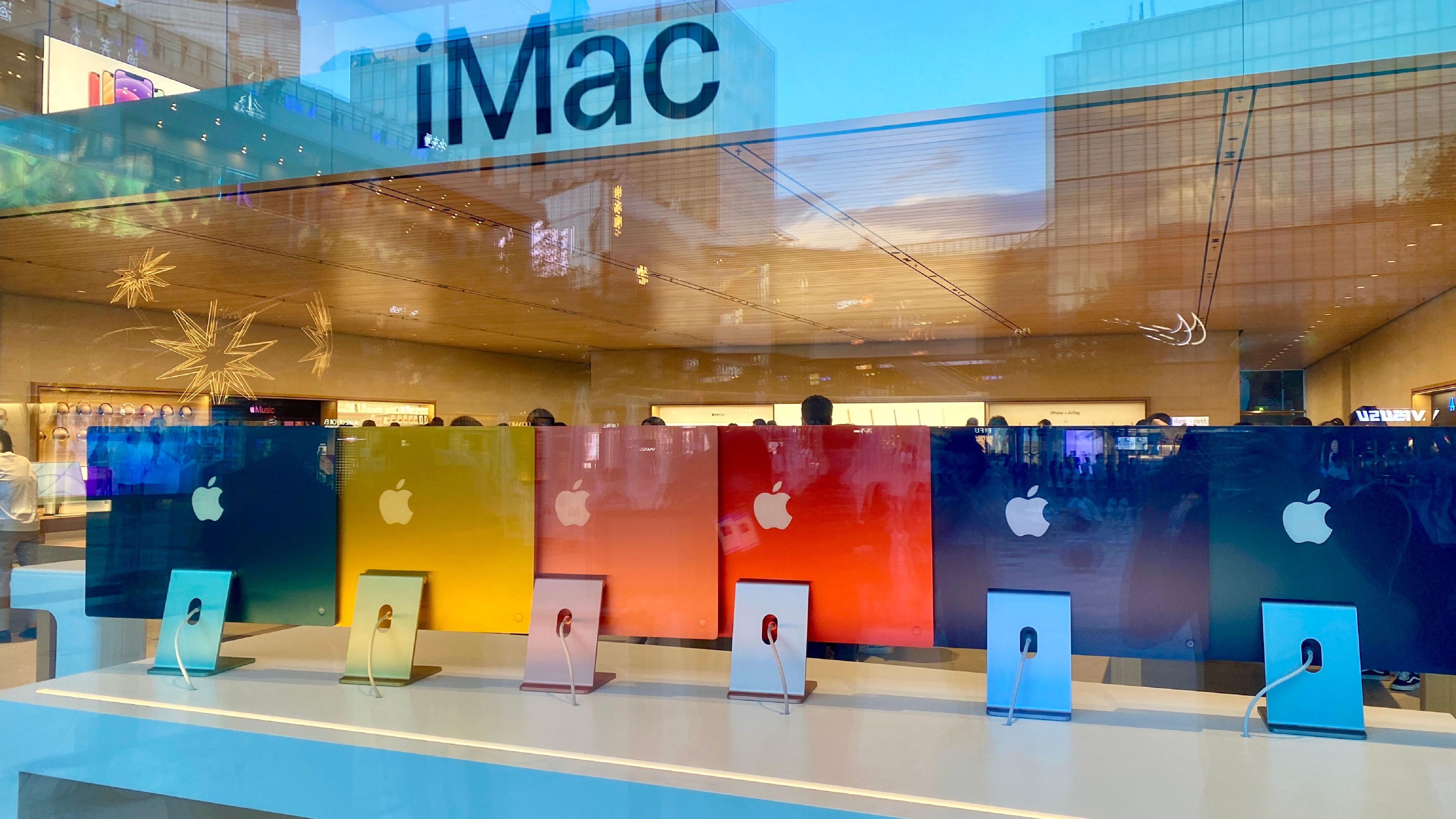Beijing, China - 26 May, 2021: Brand new 2021 colorful iMac&amp;rsquo;s in Apple Store. Customers are waiting in line to get new products from Apple.