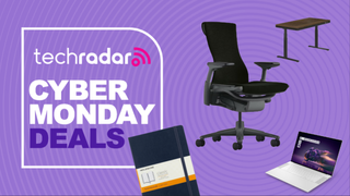 A notebook, standing desk, office chair, and laptop on a purple background next to a TechRadar badge reading 'Cyber Monday deals'