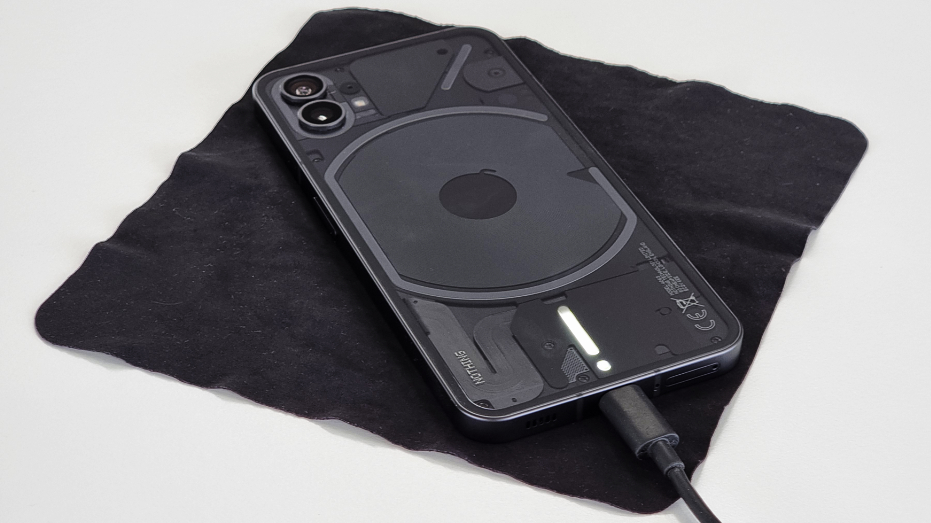 Nothing Phone 1 front angled on table charging