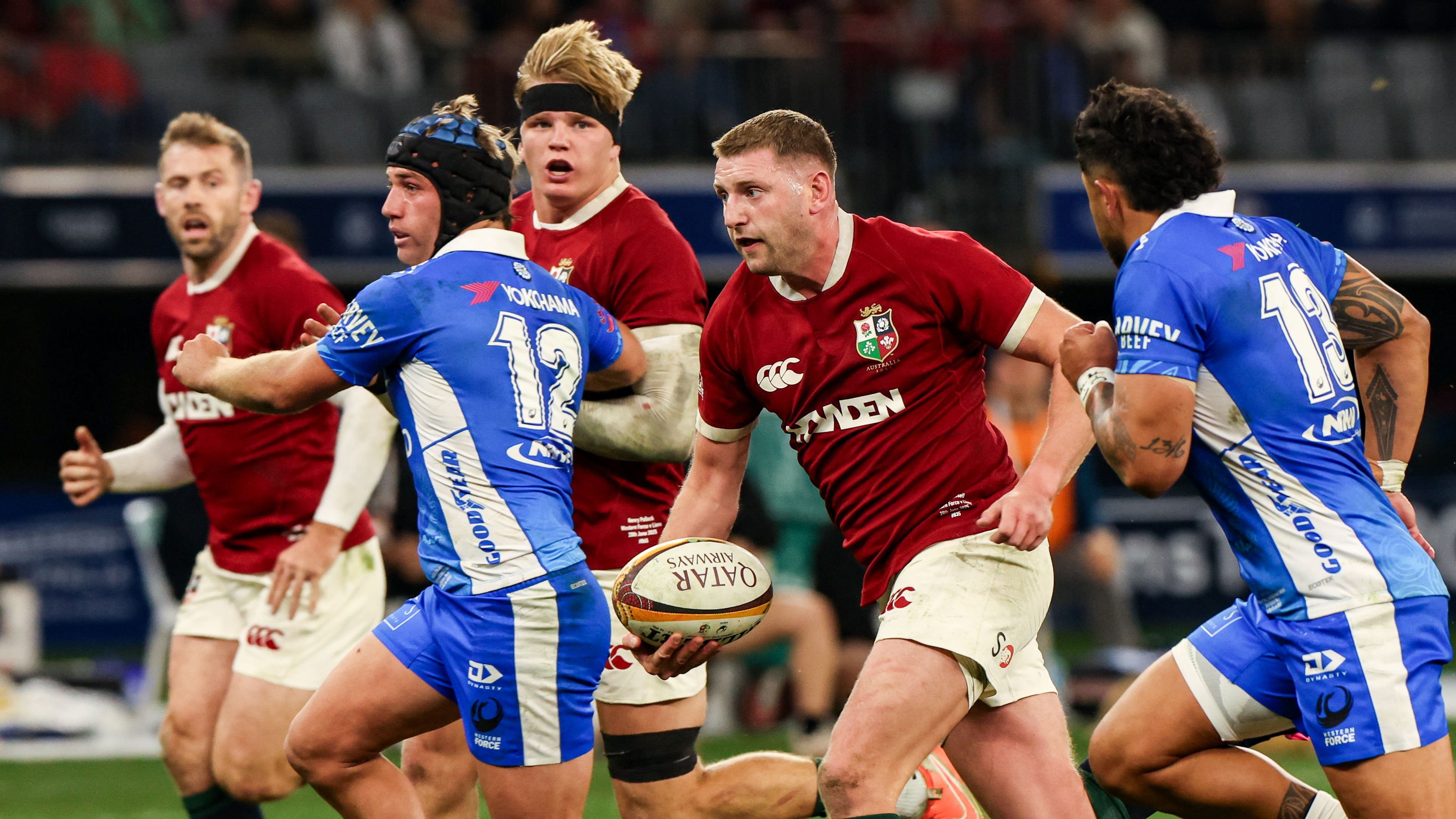 Finn Russell of British &amp; Irish Lions makes a break in the lead up to his side's third try, scored by Elliot Daly, left, during the tour match between Western Force and the British &amp; Irish Lions at Optus Stadium in Perth, Australia.