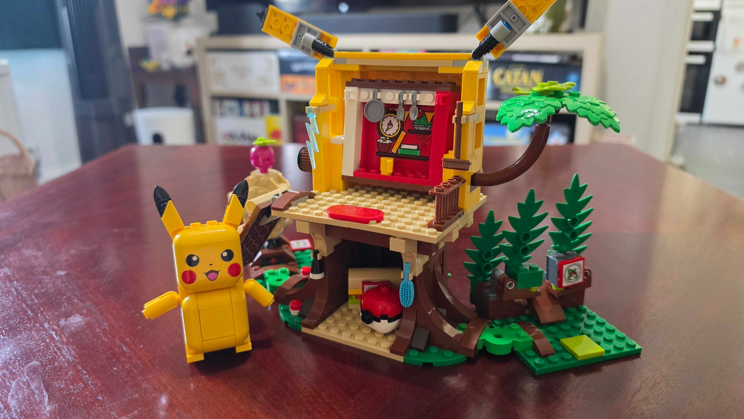 Pikachu next to his house
