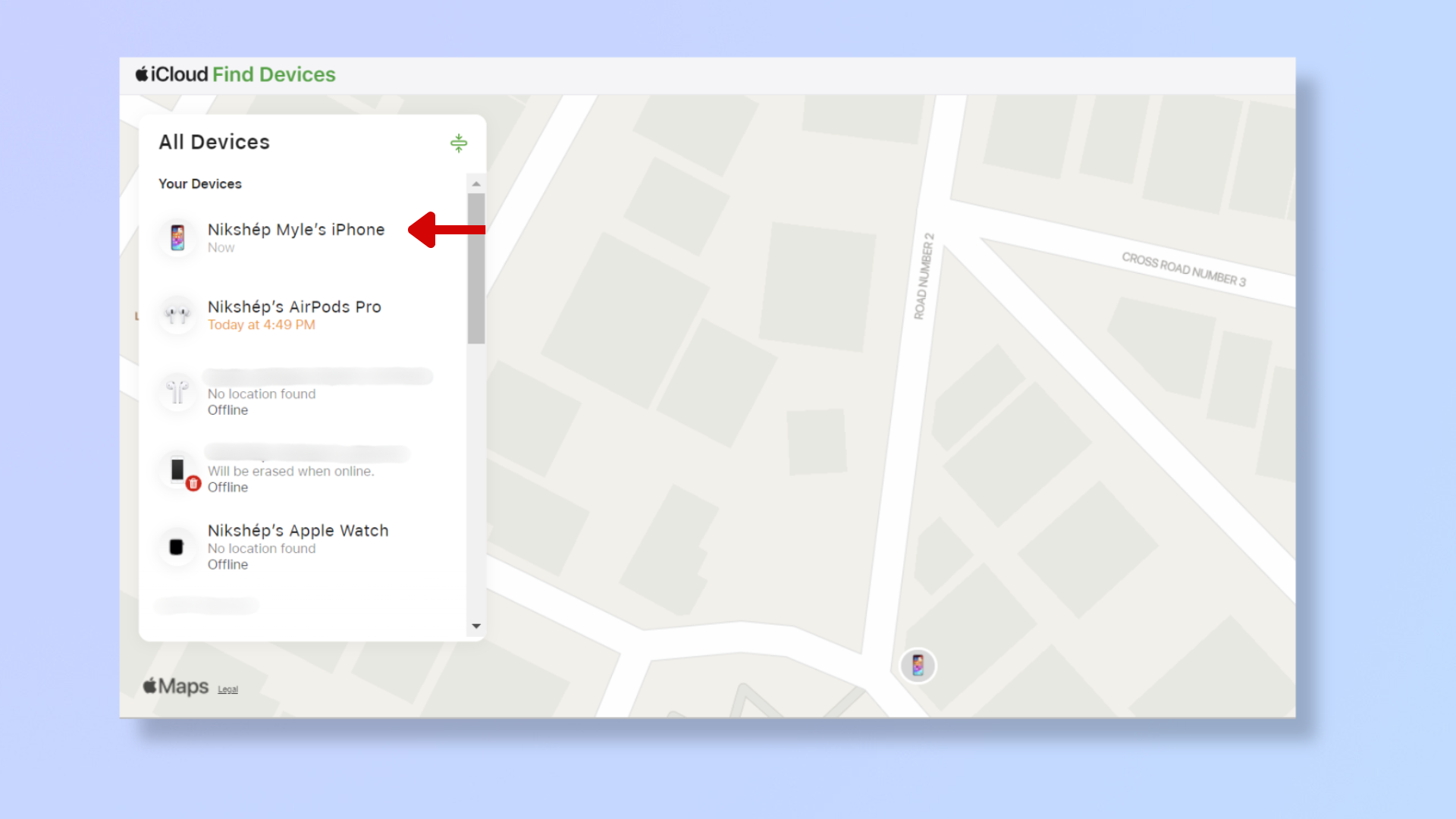 A screenshot of the icloud.com Find My Devices page, with a red arrow pointing at an iPhone.