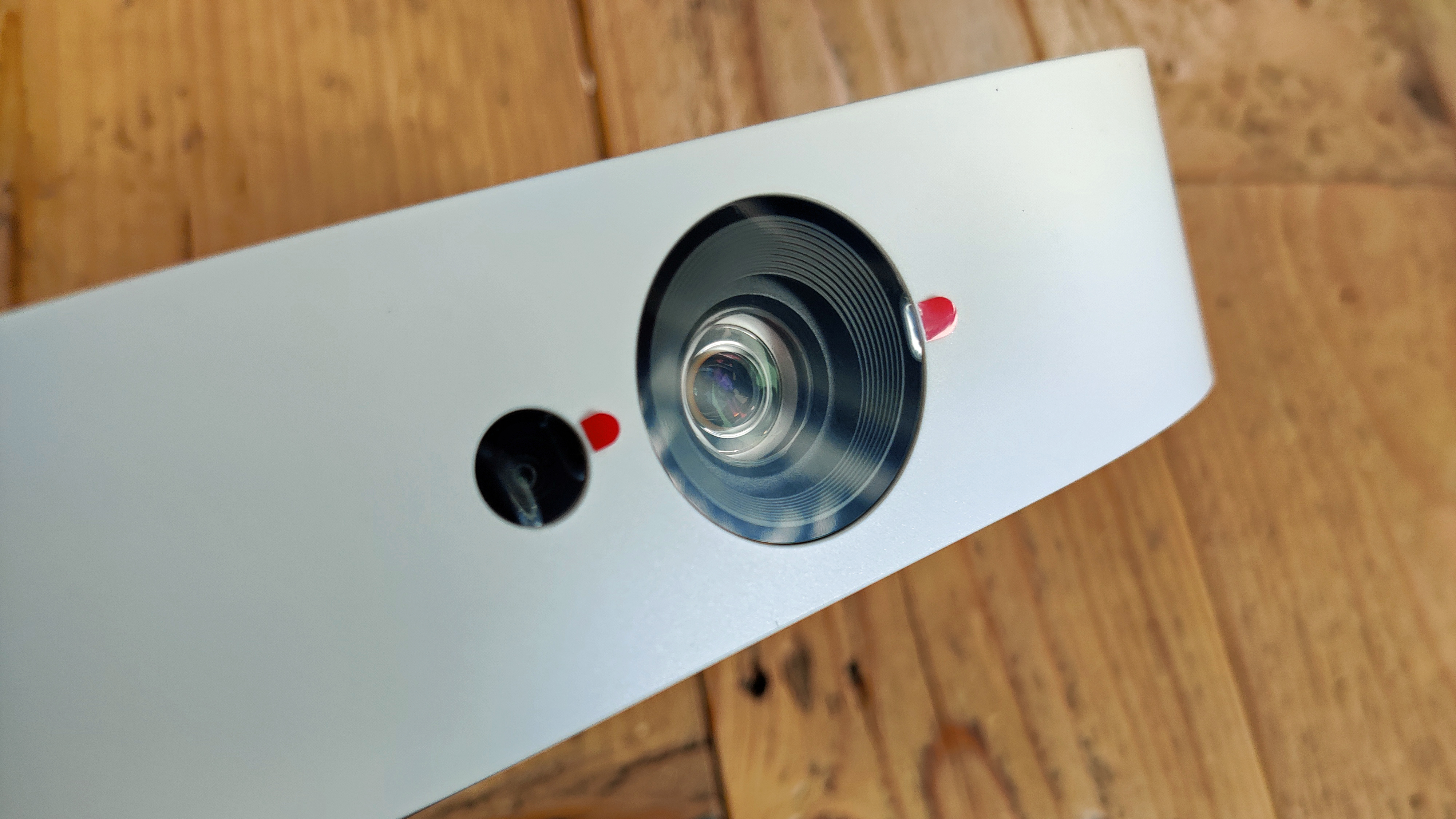 Anker Nebula Solar Portable projector against wooden background