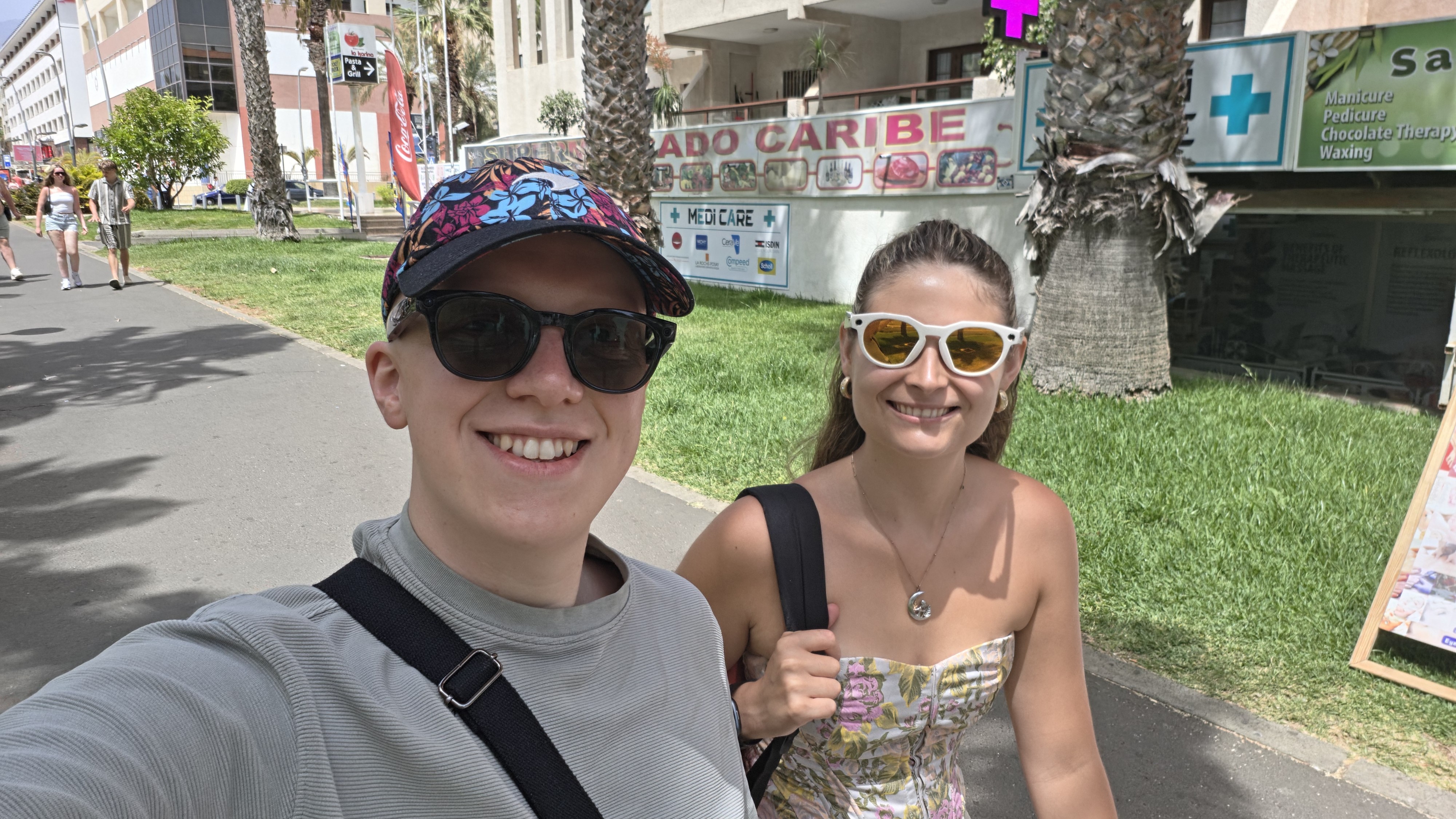 Izzy wearing Oakley meta HSTN glasses in Tenerife while walking with Hamish in his Meta Optics