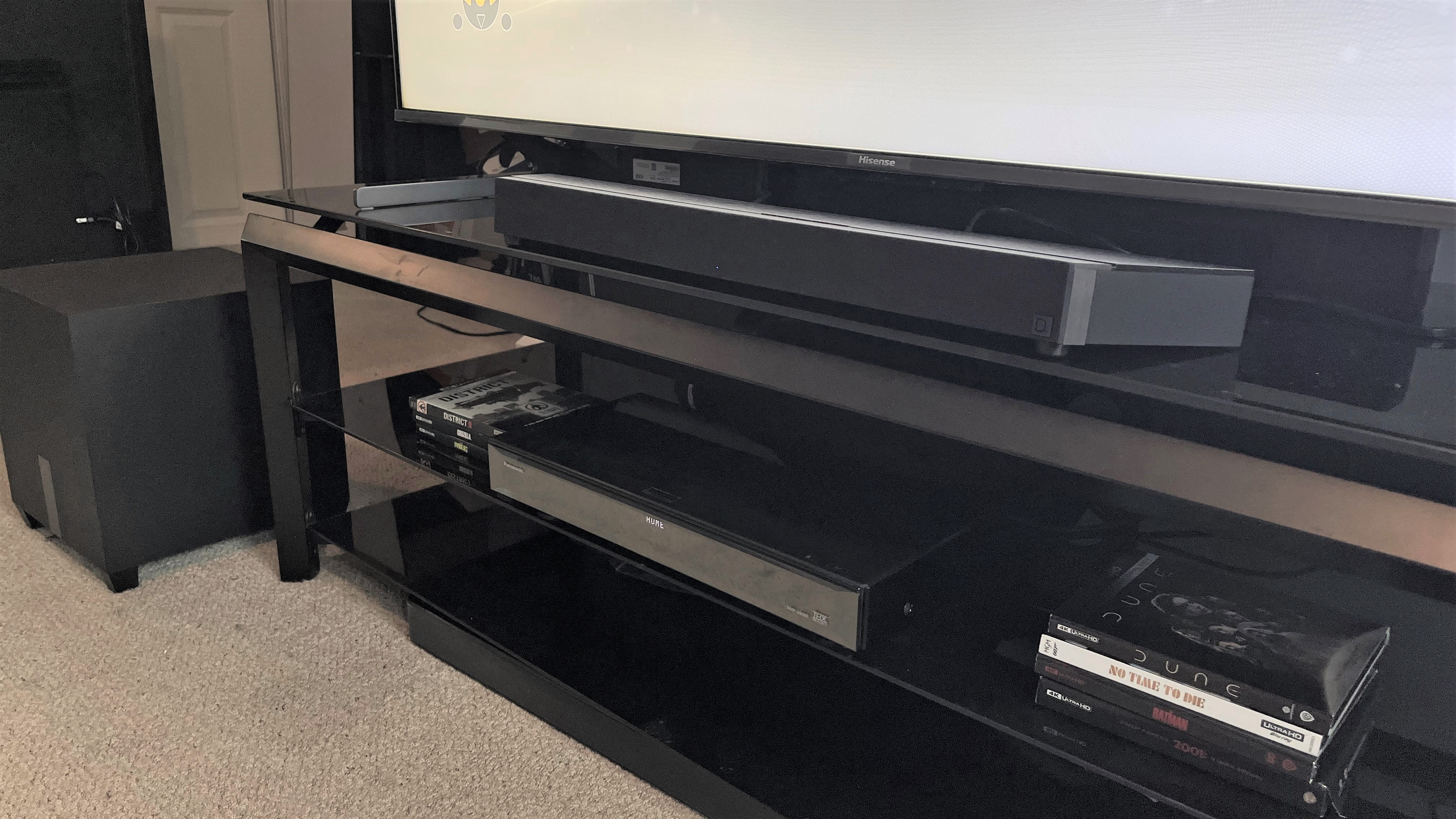 Definitive Technology Studio 3D Mini soundbar with subwoofer on white carpet