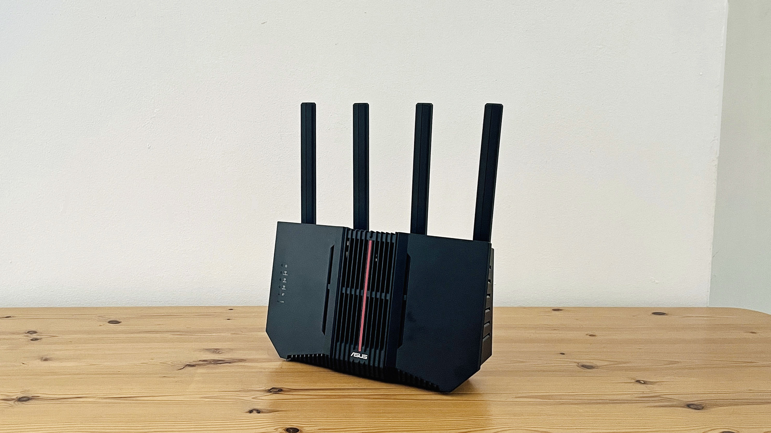 Asus RT-BE92U router on wooden table