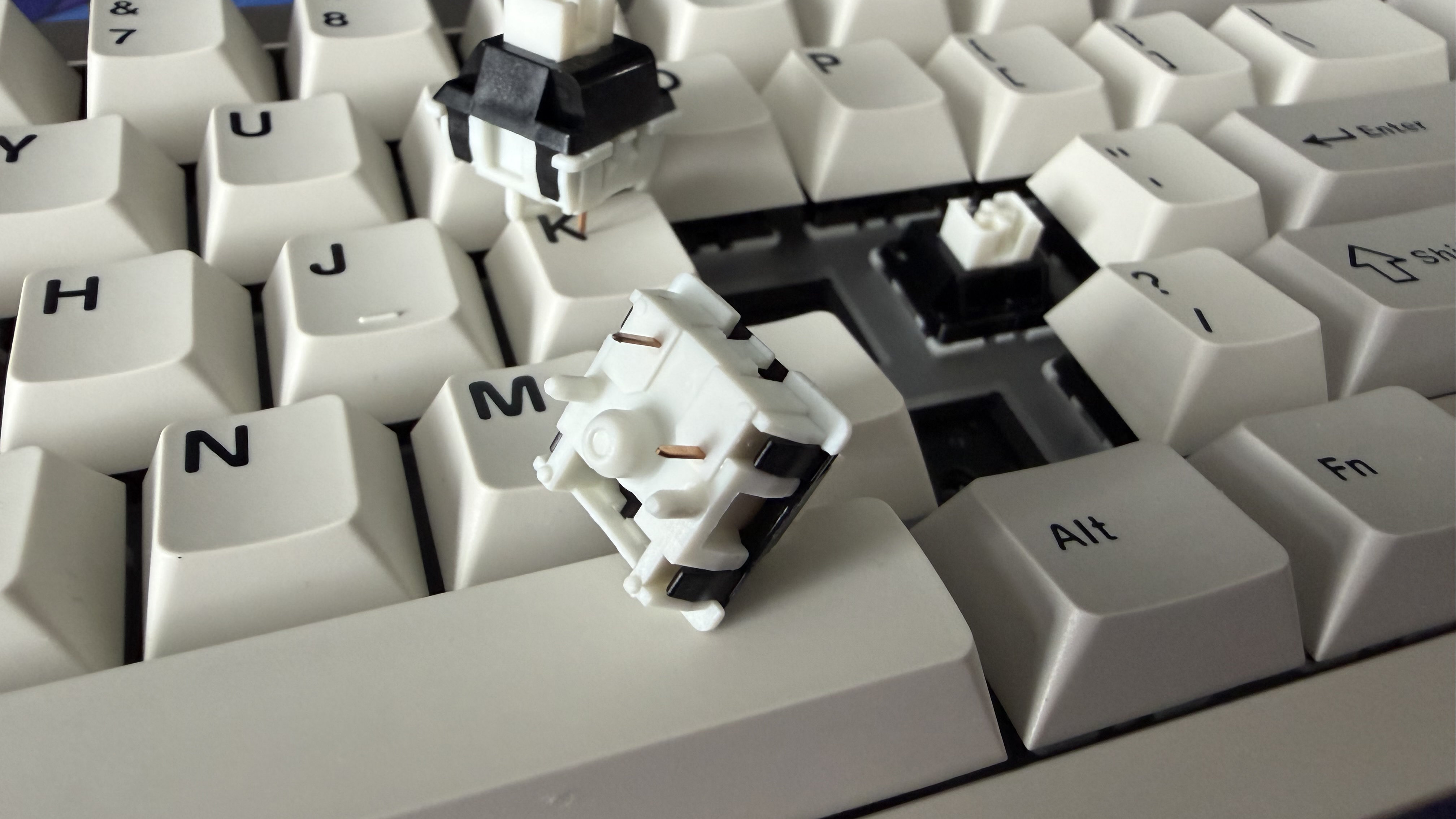 Switches being removed from the Epomaker 65.